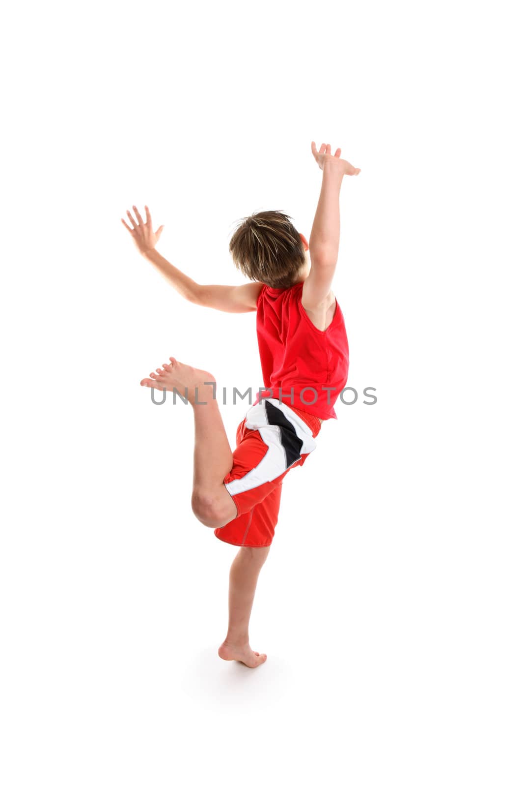 An excited  boy feeling good is  leaping for joy