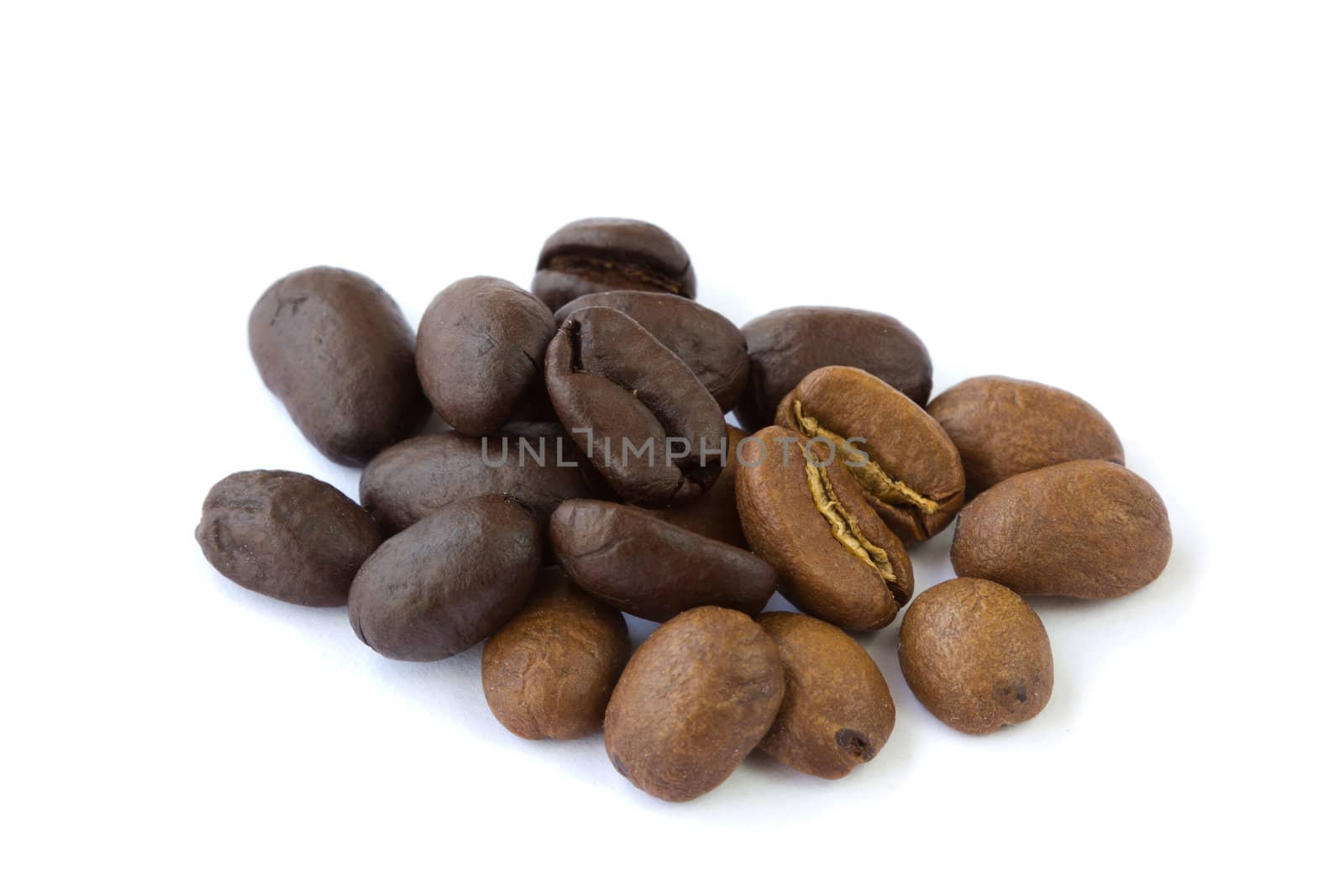 Brown and black coffee beans isolated on white background