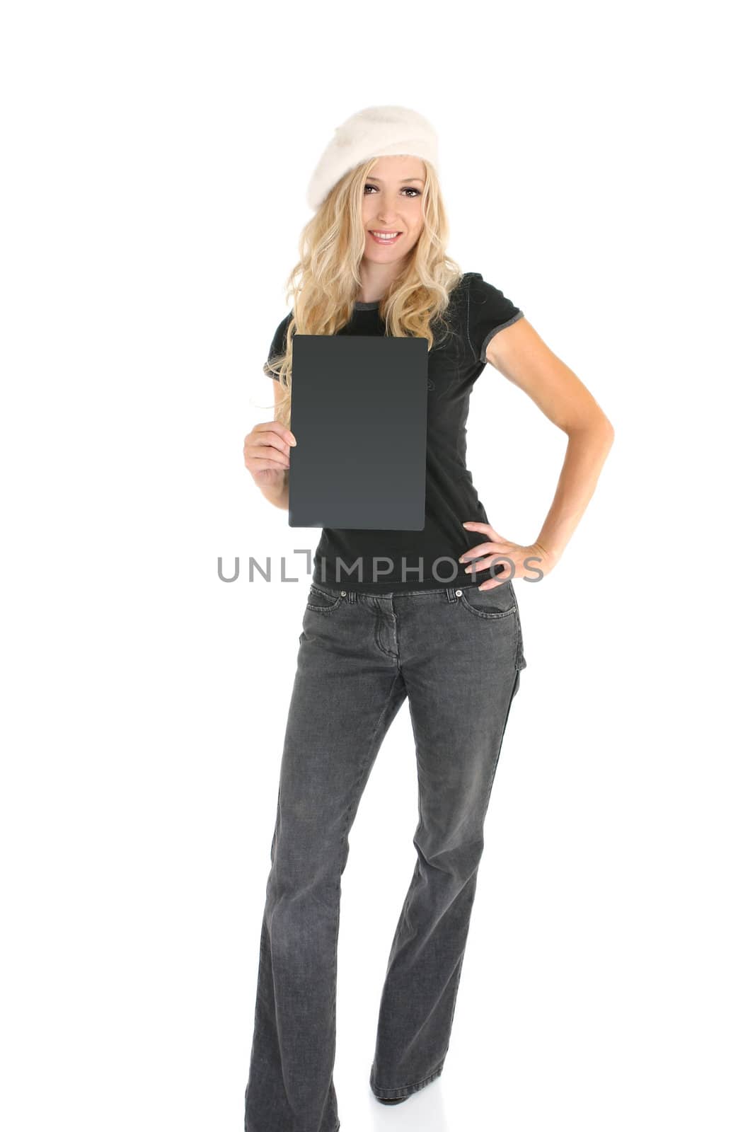 Casual woman in jeans and t-shirt  holding a sign or message. Add text or replace with a book, brochure, etc.