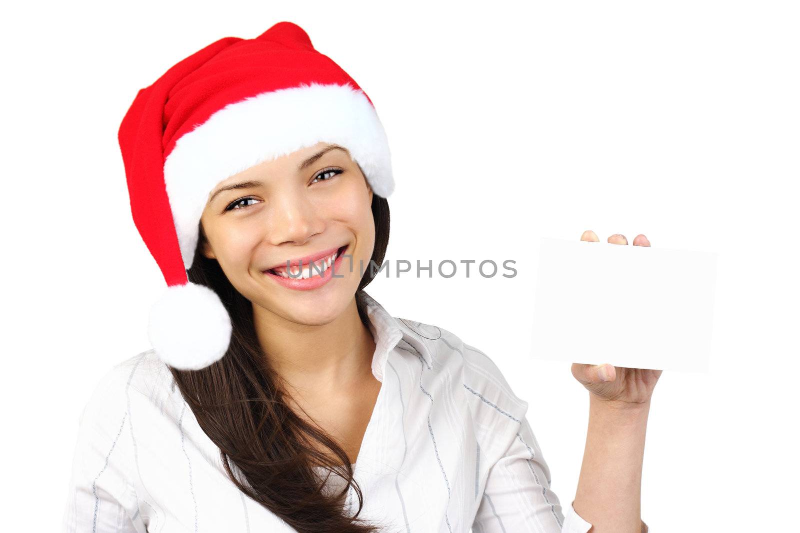 Christmas sign.  Woman with santa hat holding blank paper sign. Very beautiful mixed race asian / caucasian woman smiling. Isolated on white background.