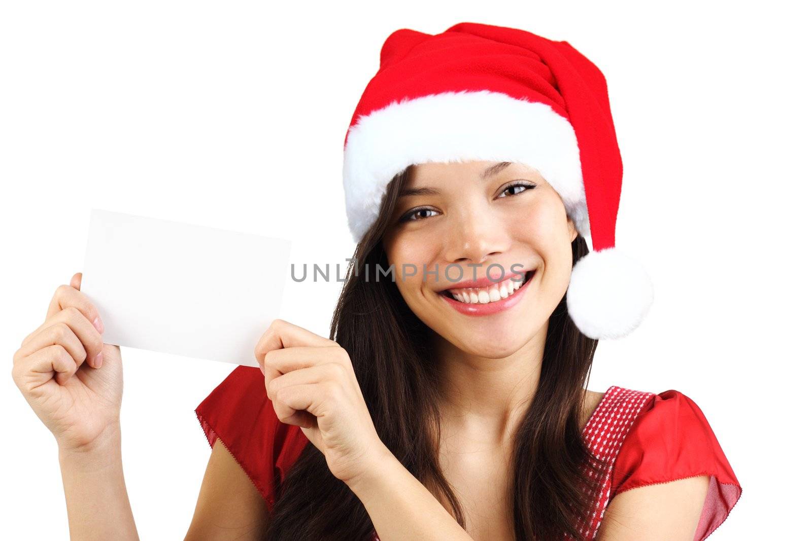 Christmas woman holding blank paper sign. Very beautiful mixed race asian / caucasian woman smiling. Isolated on white background.