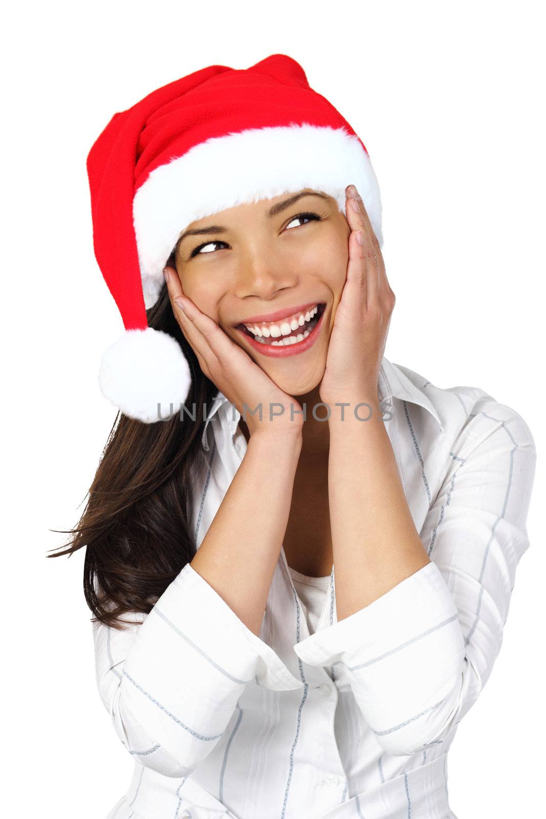  Surprised Christmas Woman. Very beautiful surprised woman with santa hat holding her head in amazement and Looking to the side. Isolated on seamless white backgrund.