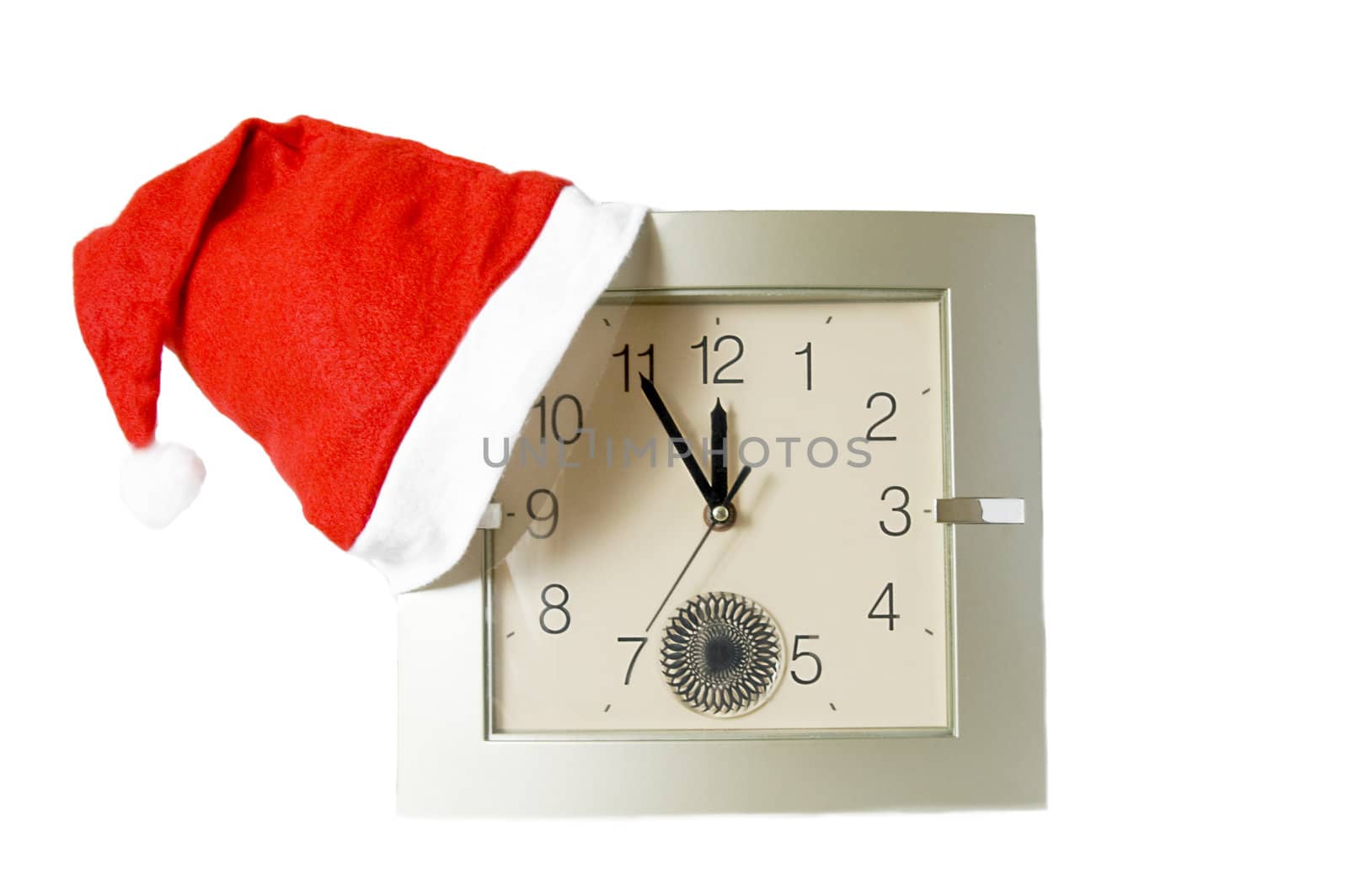 Santa red cap on clock isolated over white
