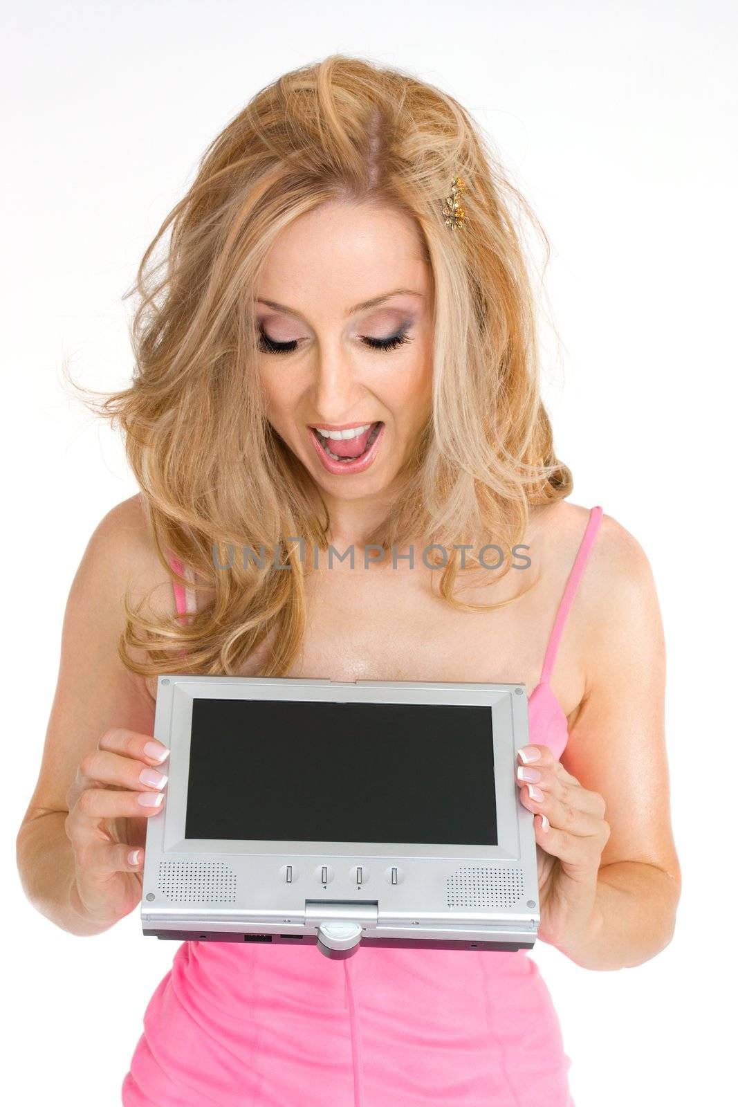 Excited woman looks at a portable electronic lcd screen