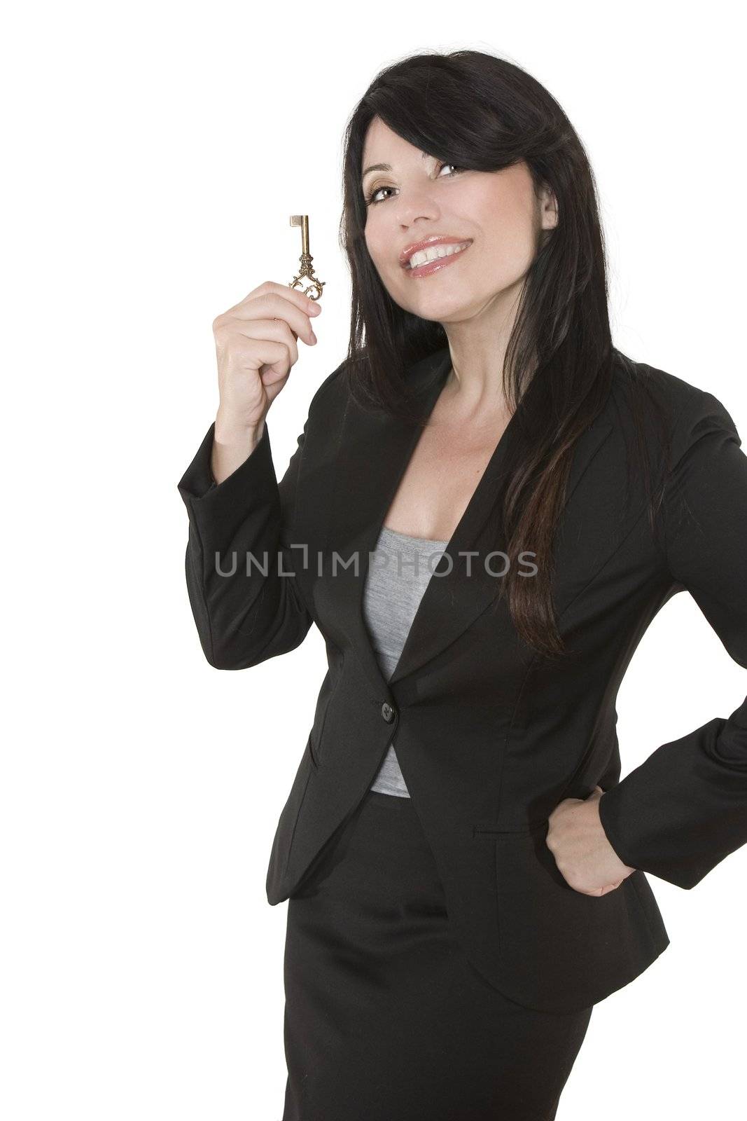 Smiling woman holding a key in her hand