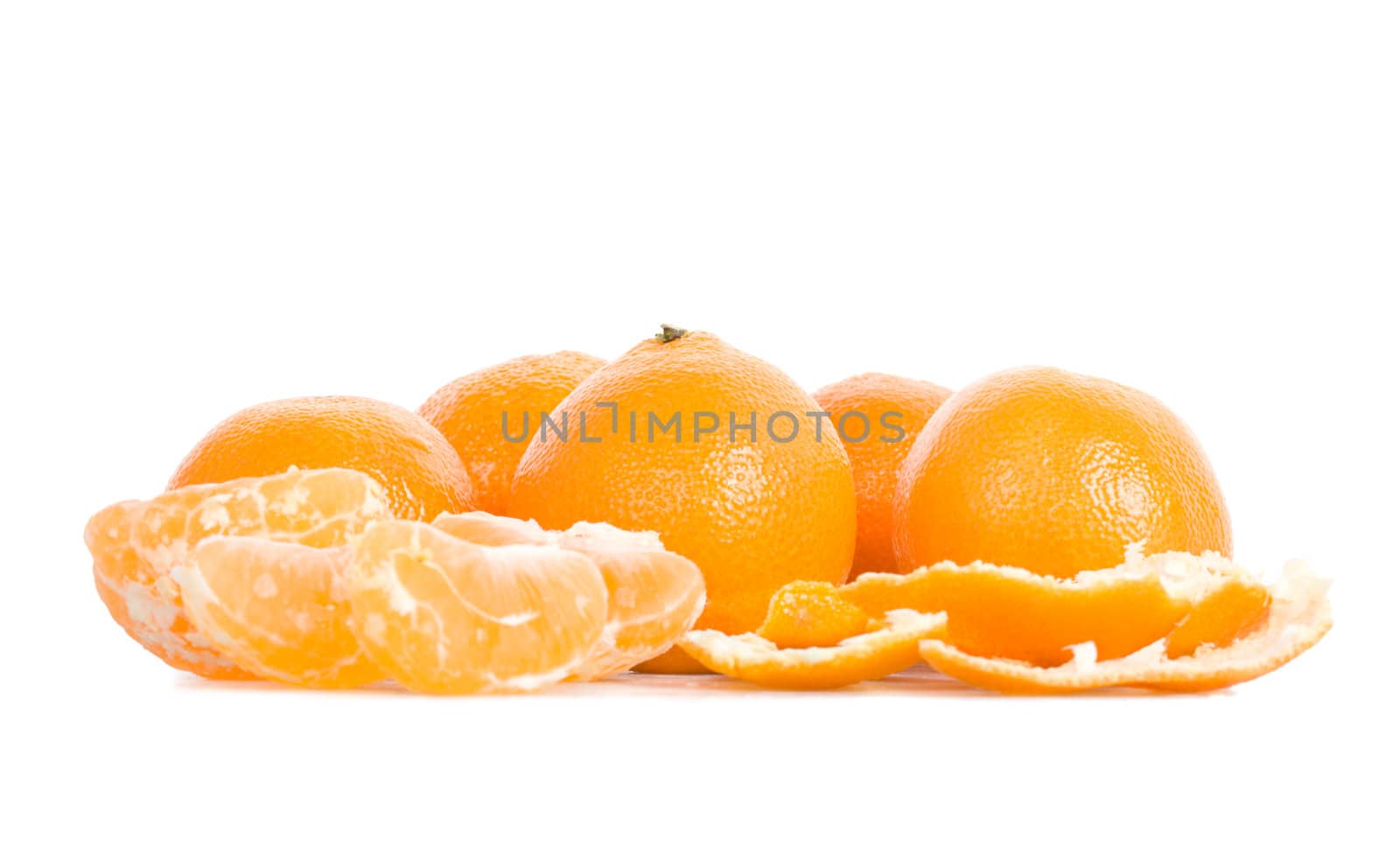 many tangerines with peel and segments, isolated on white