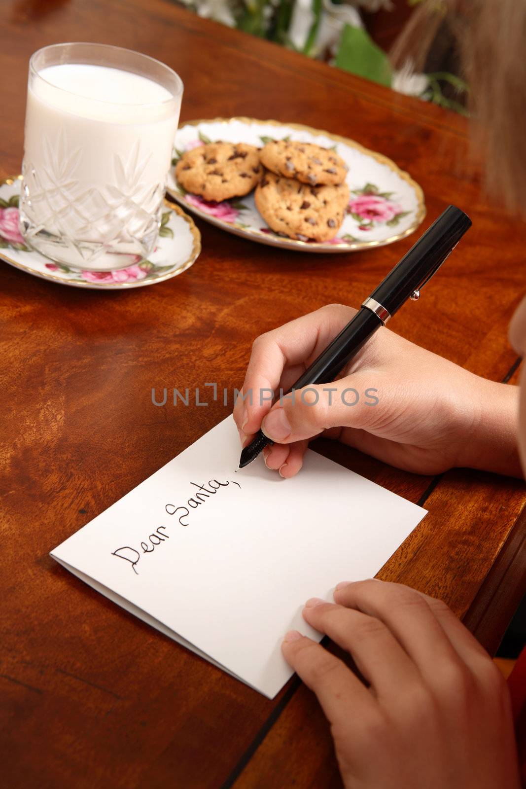 A child writing a letter to Santa