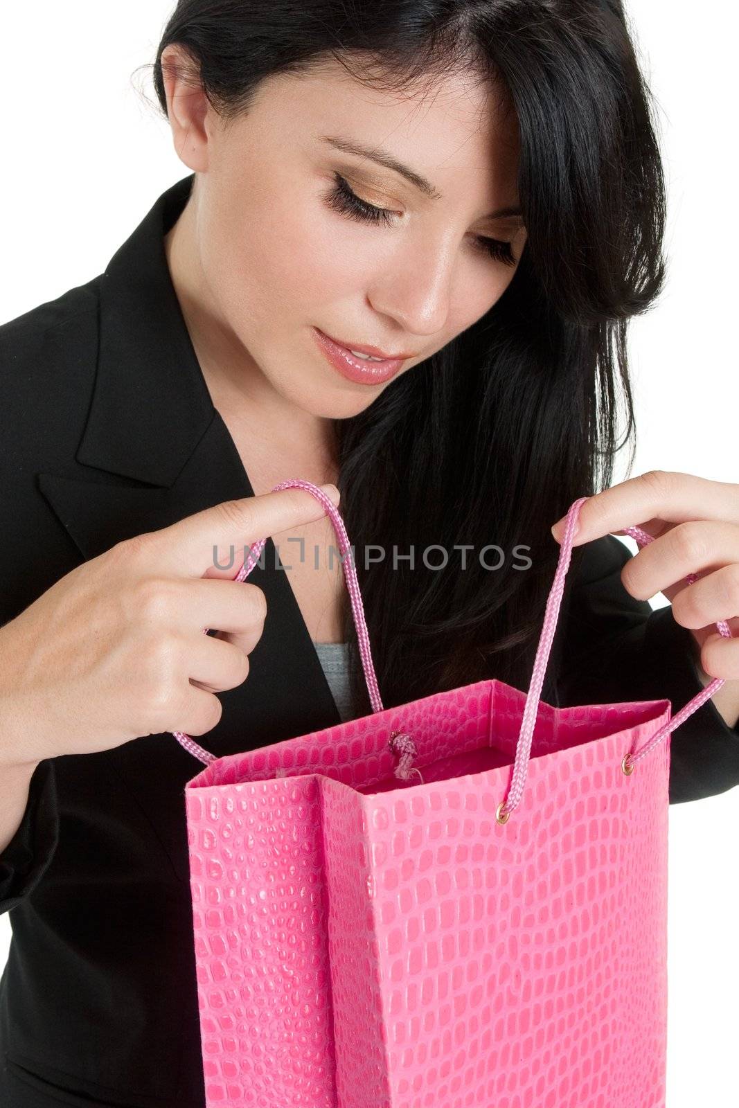 A woman peers into a colourful gift or shopping bag