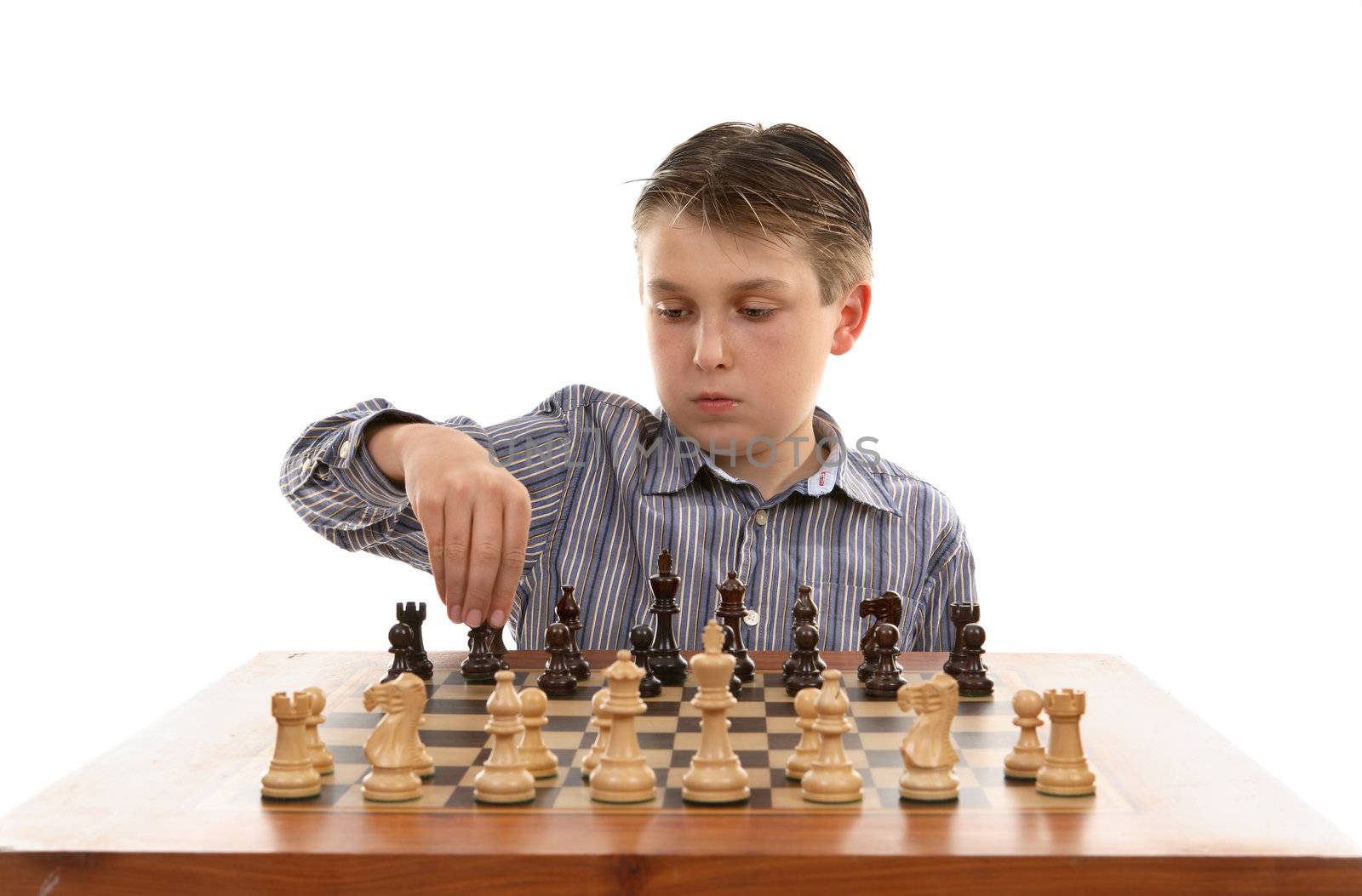 A young player setting up a chess table