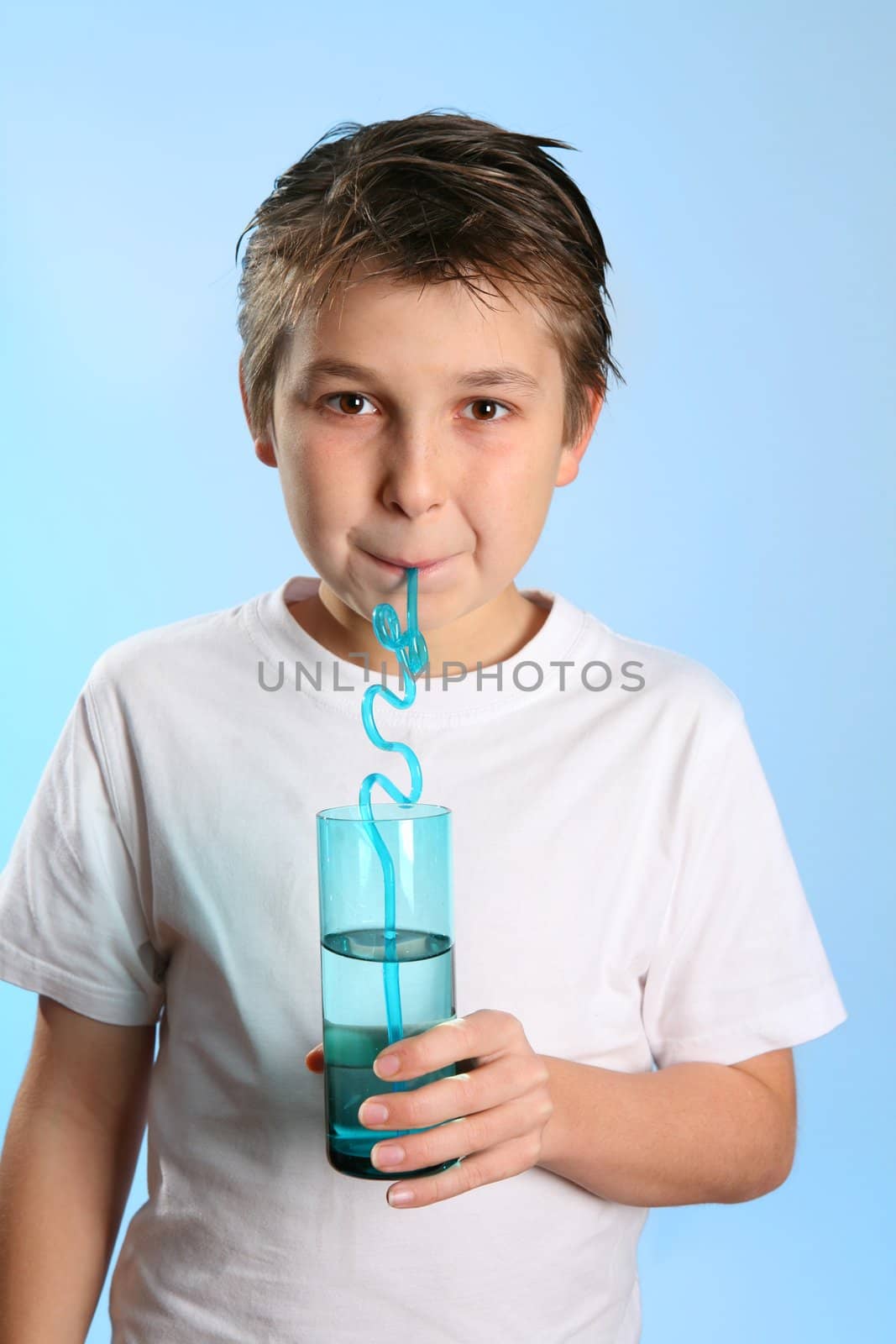 Child sips water from a glass 