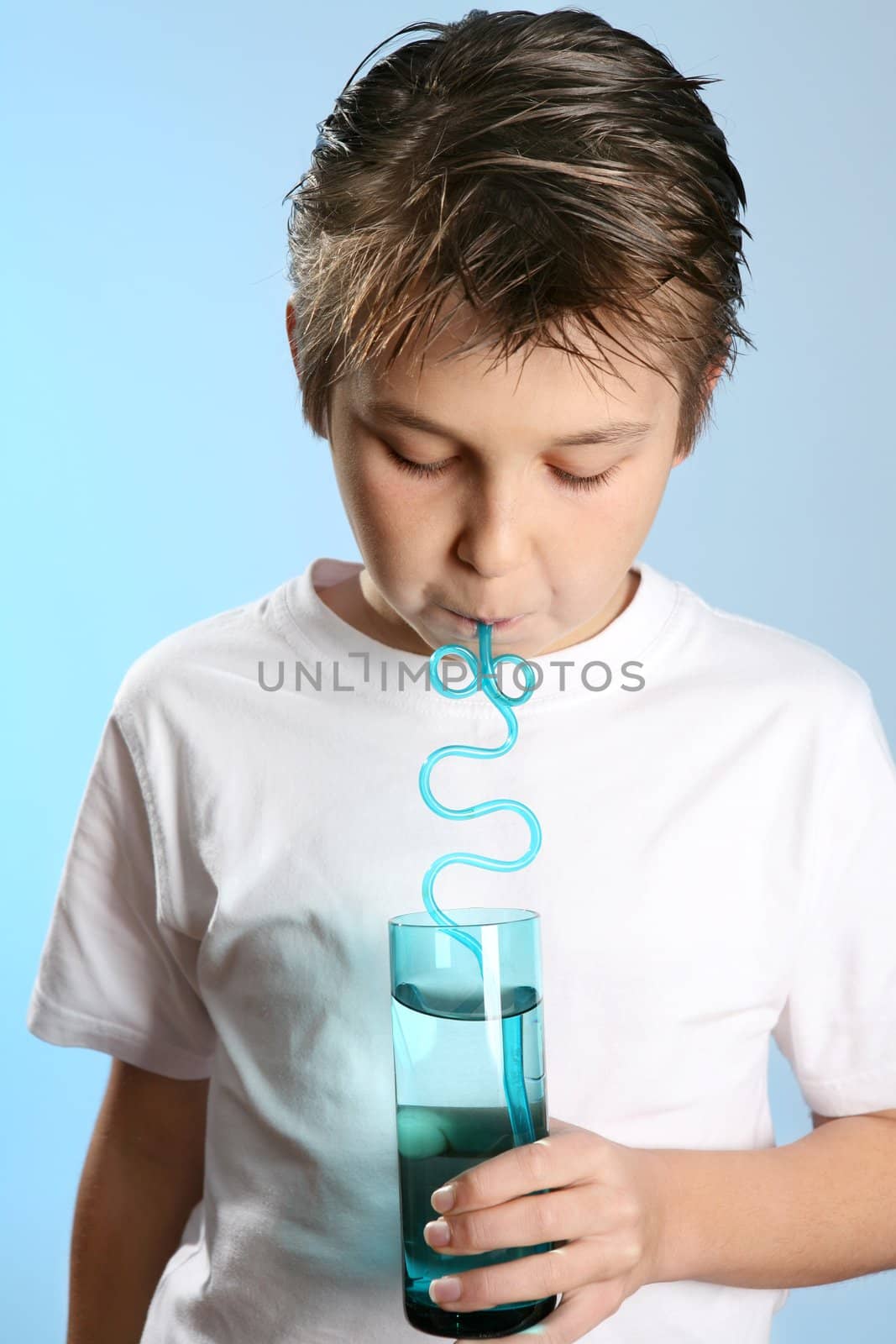 Closeup of a child drinking through a straw