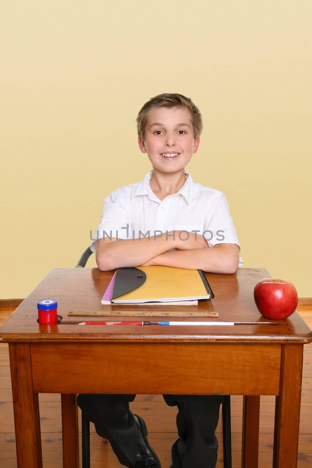 School boy sitting up straight in class