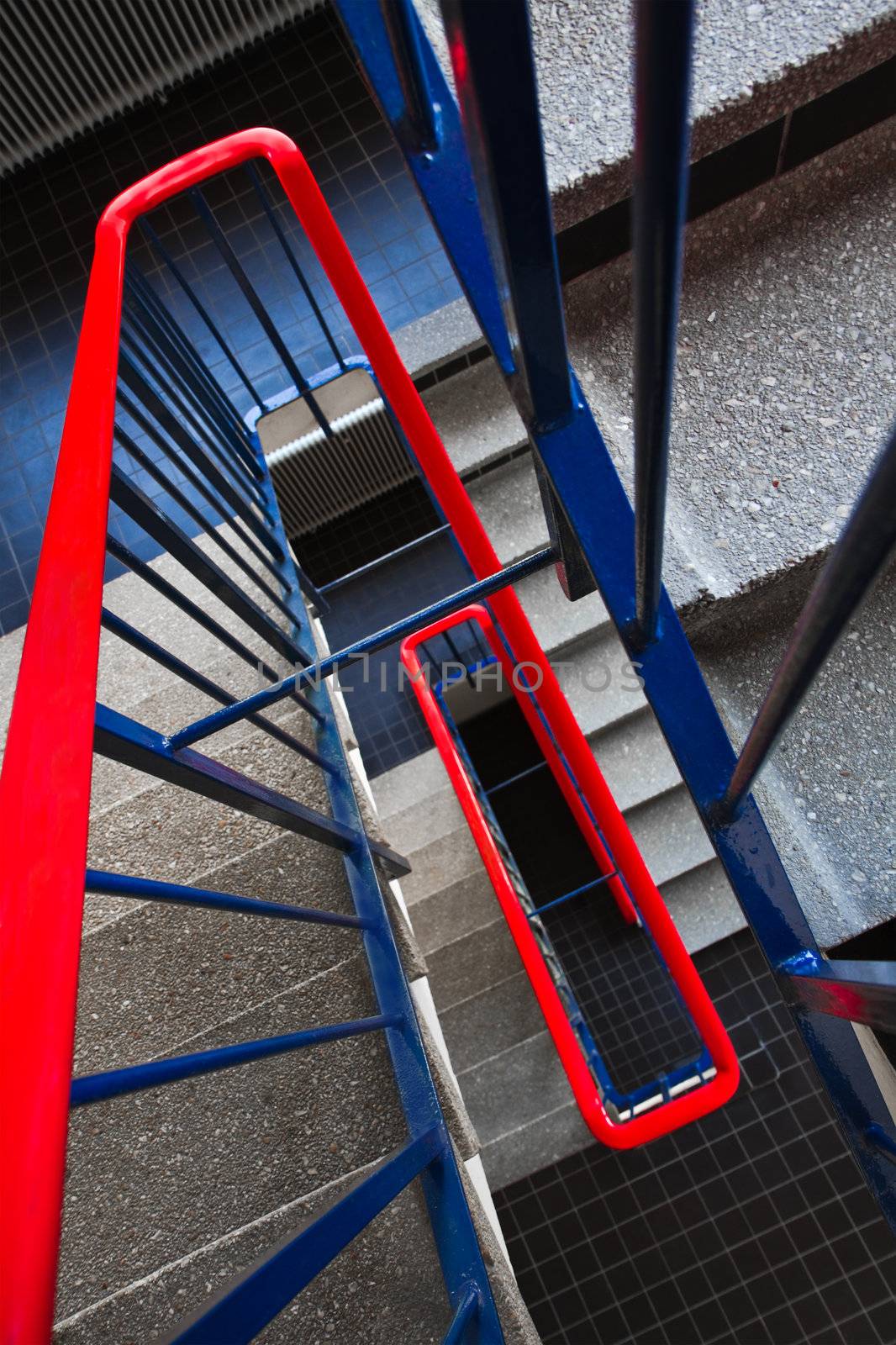 Staircase in building with red and blue colors