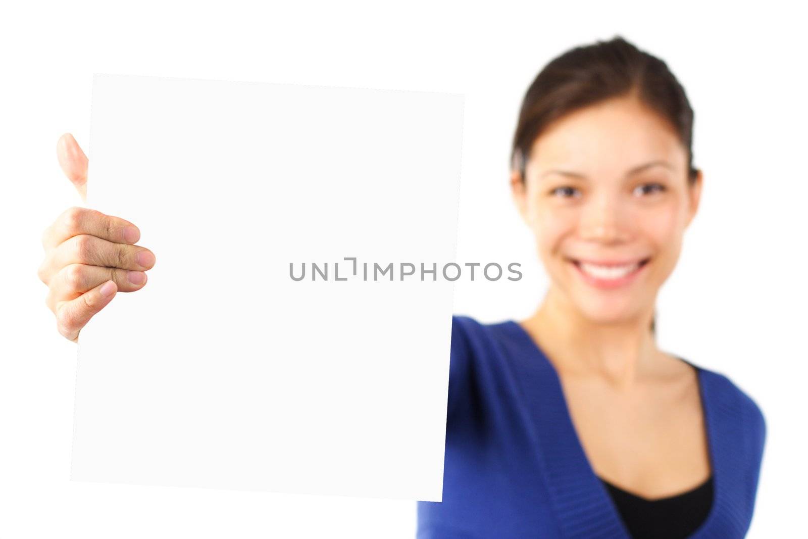 Ethnic young student showing a blank placard with copy space. Isolated on white background.