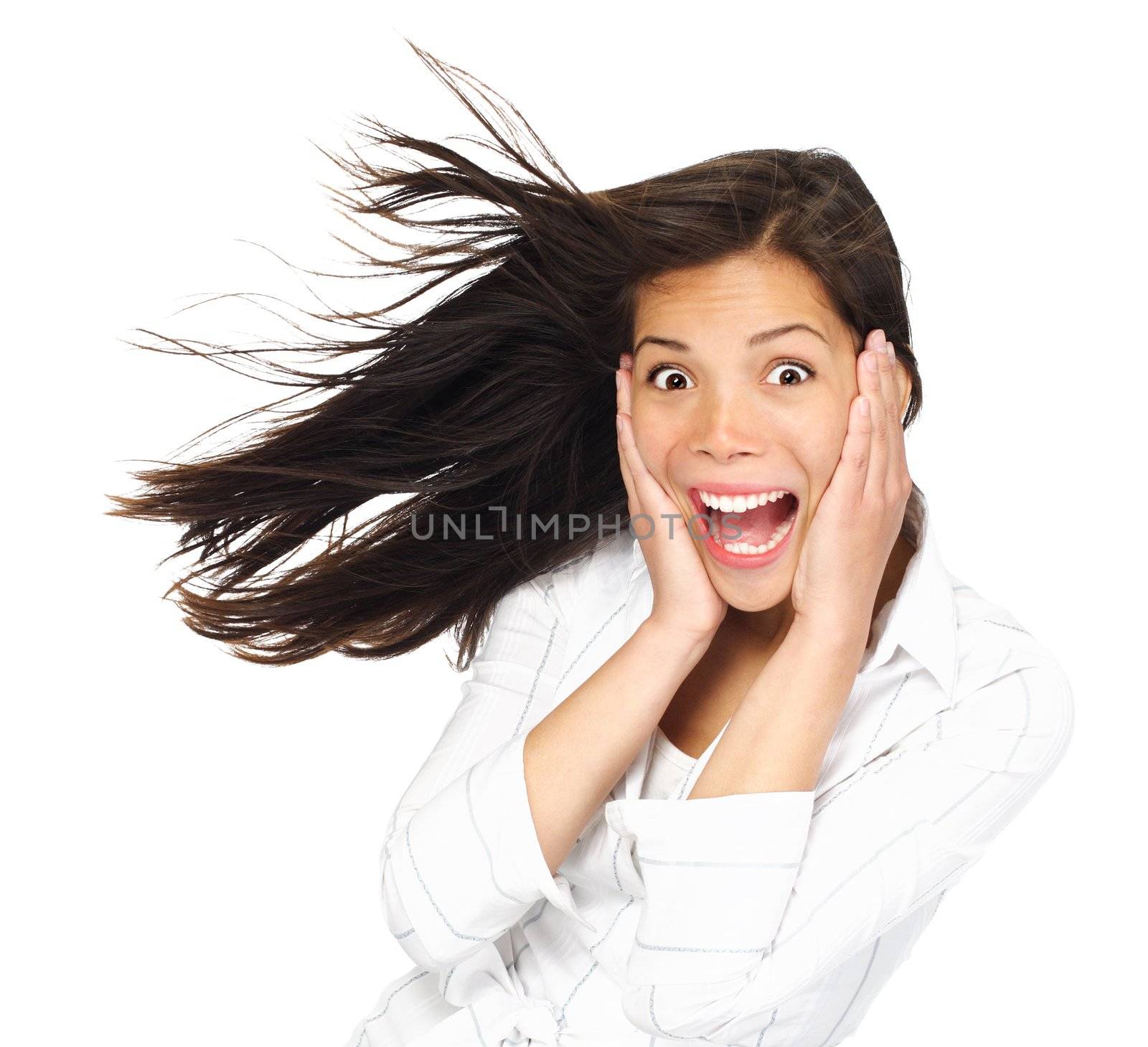 Very excited woman holding her head being surprised and looking at the camera. Mixed race caucasian / asian woman model. Isolated on white background.