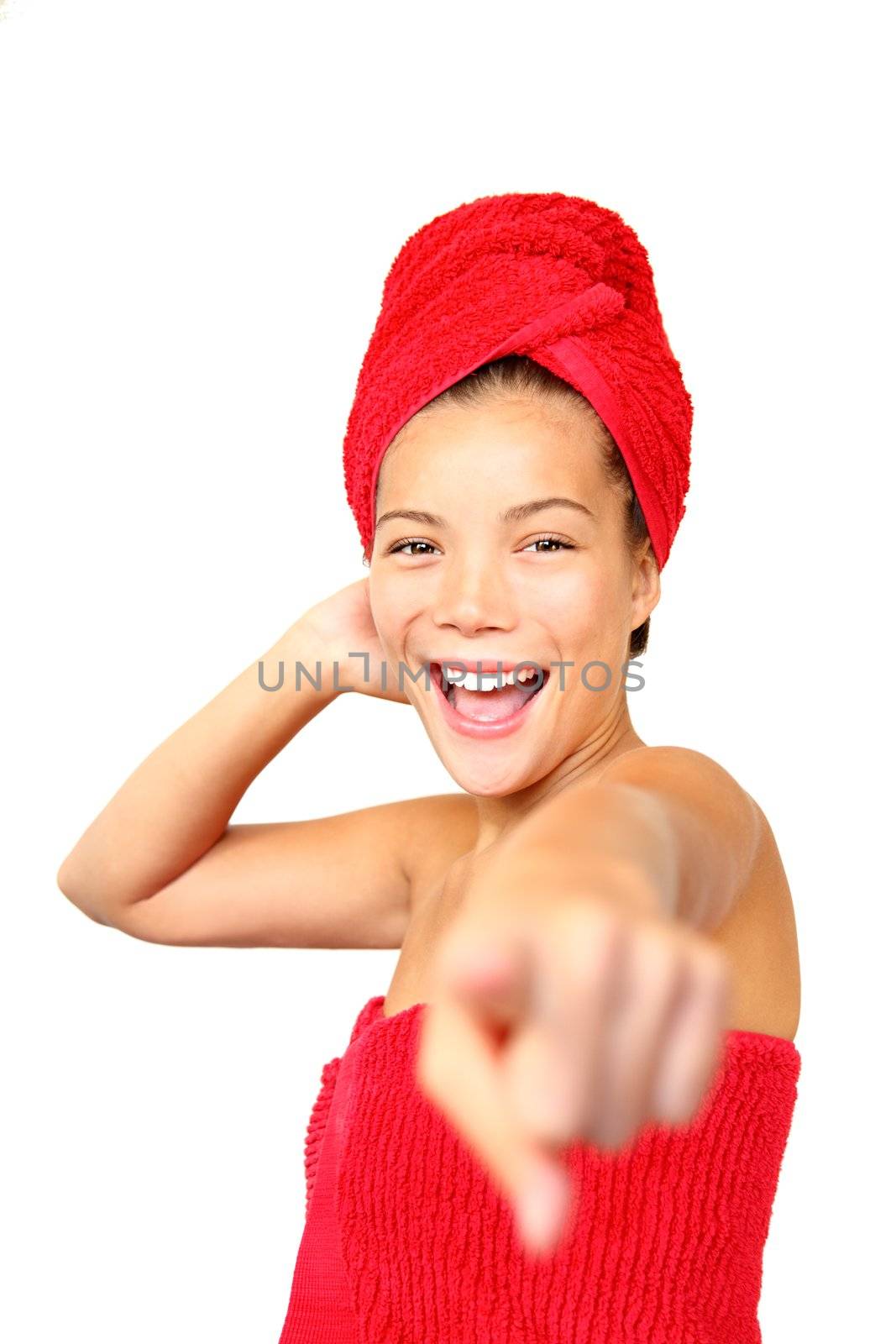 Shower woman in towels pointing excited at the camera. Beautiful young mixed race asian / caucasian woman model. 