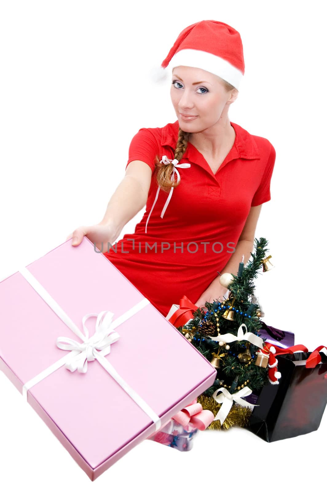 Santa woman helper with Christmas tree and gifts over white