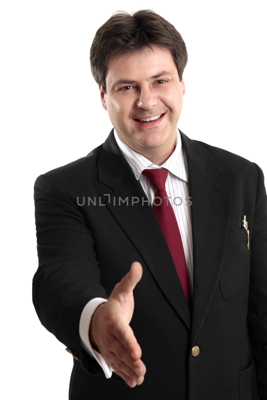 Businessman extends his hand to seal a deal or greeting a fellow colleague or businessman.