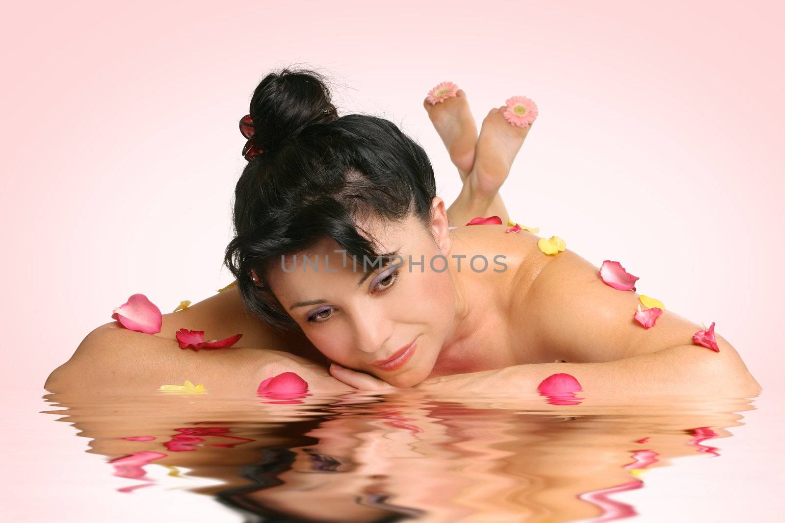 A beautiful woman with peaceful reflections.  Suitable for blissful retreats, holistic services, wellness therapies, beauty rituals, rejuvenation or spa treatments.