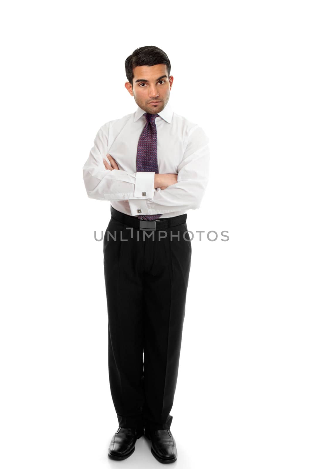 Confident business man or salesman standing with arms folded on a white background.