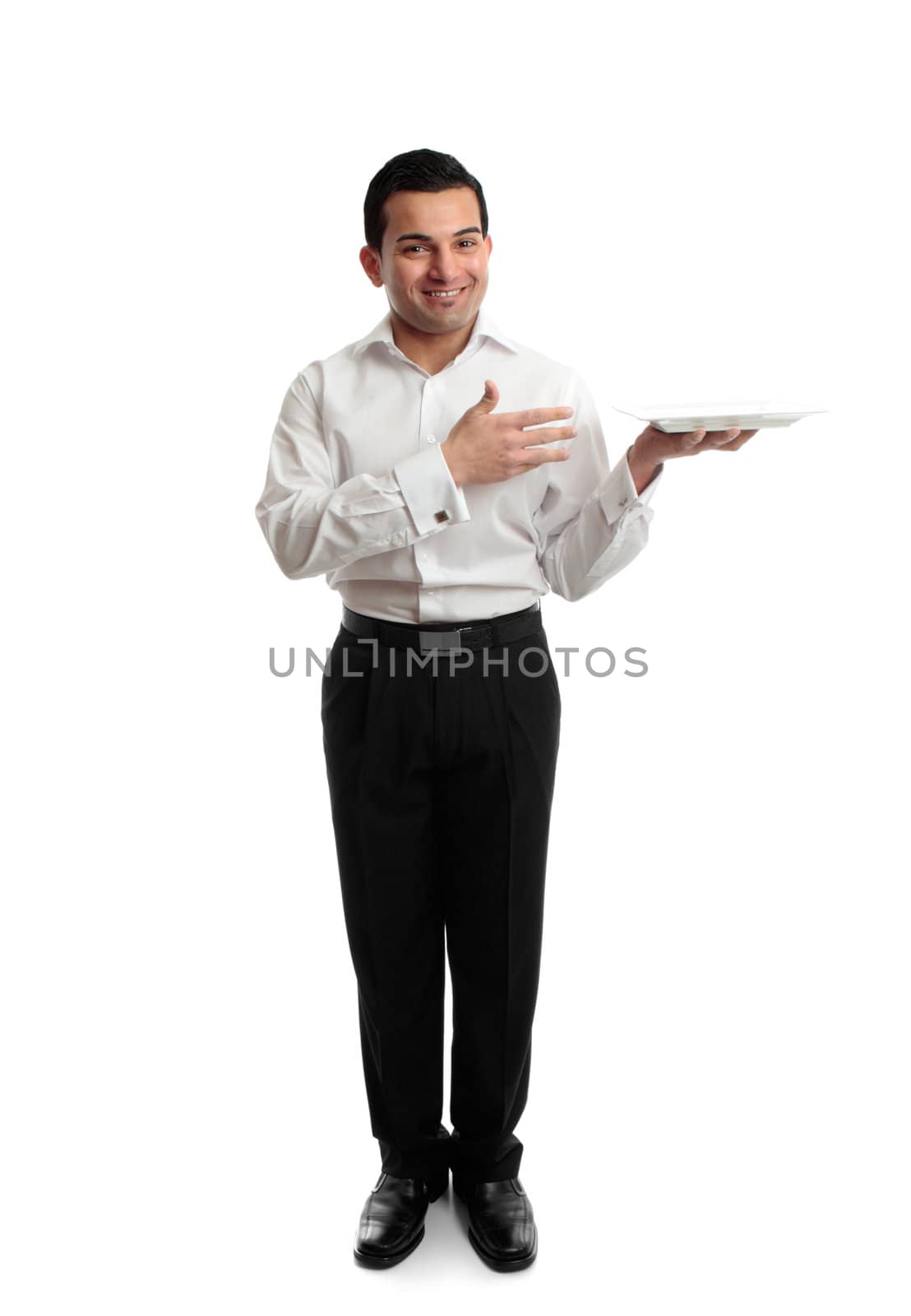 Full length smiling male hospitality worker presenting or carrying a whilte plate.