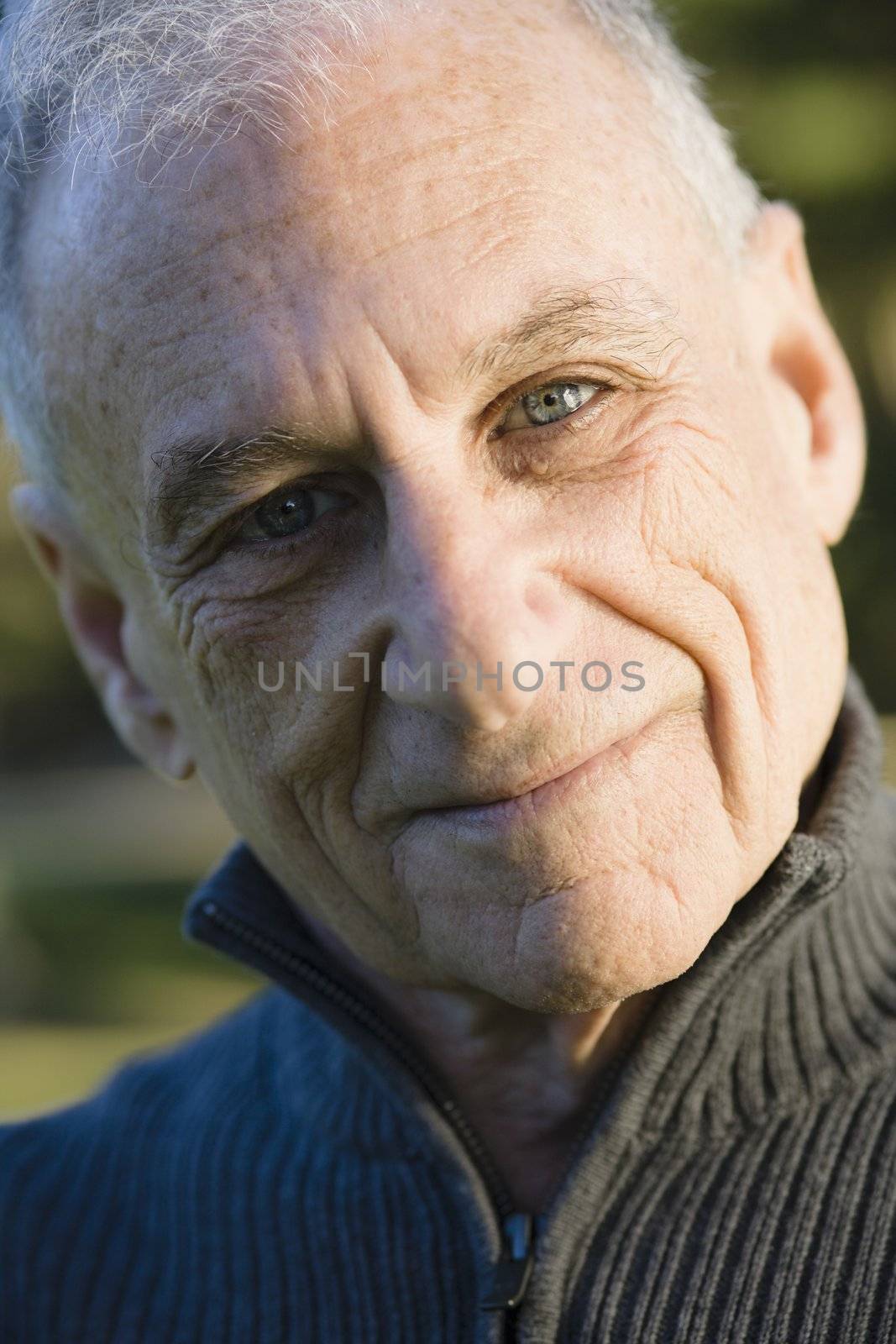 Portrait of a Senior Man Smiling Directly To Camera