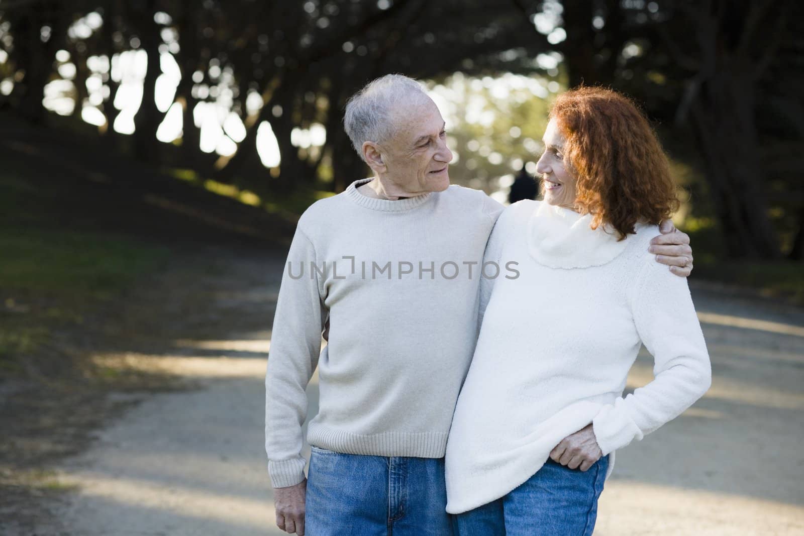 Senior Couple Smiling at Each Other in a Park