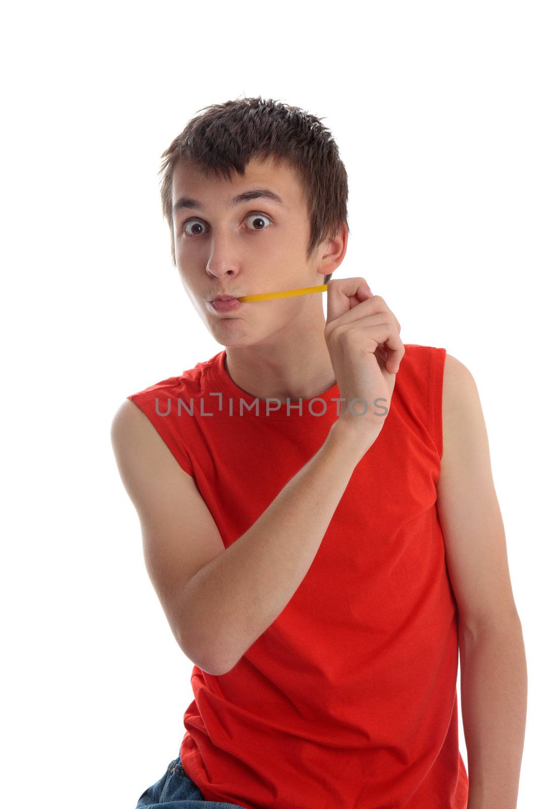 A boy having fun is stretching a delicious fruit flavoured yellow coloured jelly snake