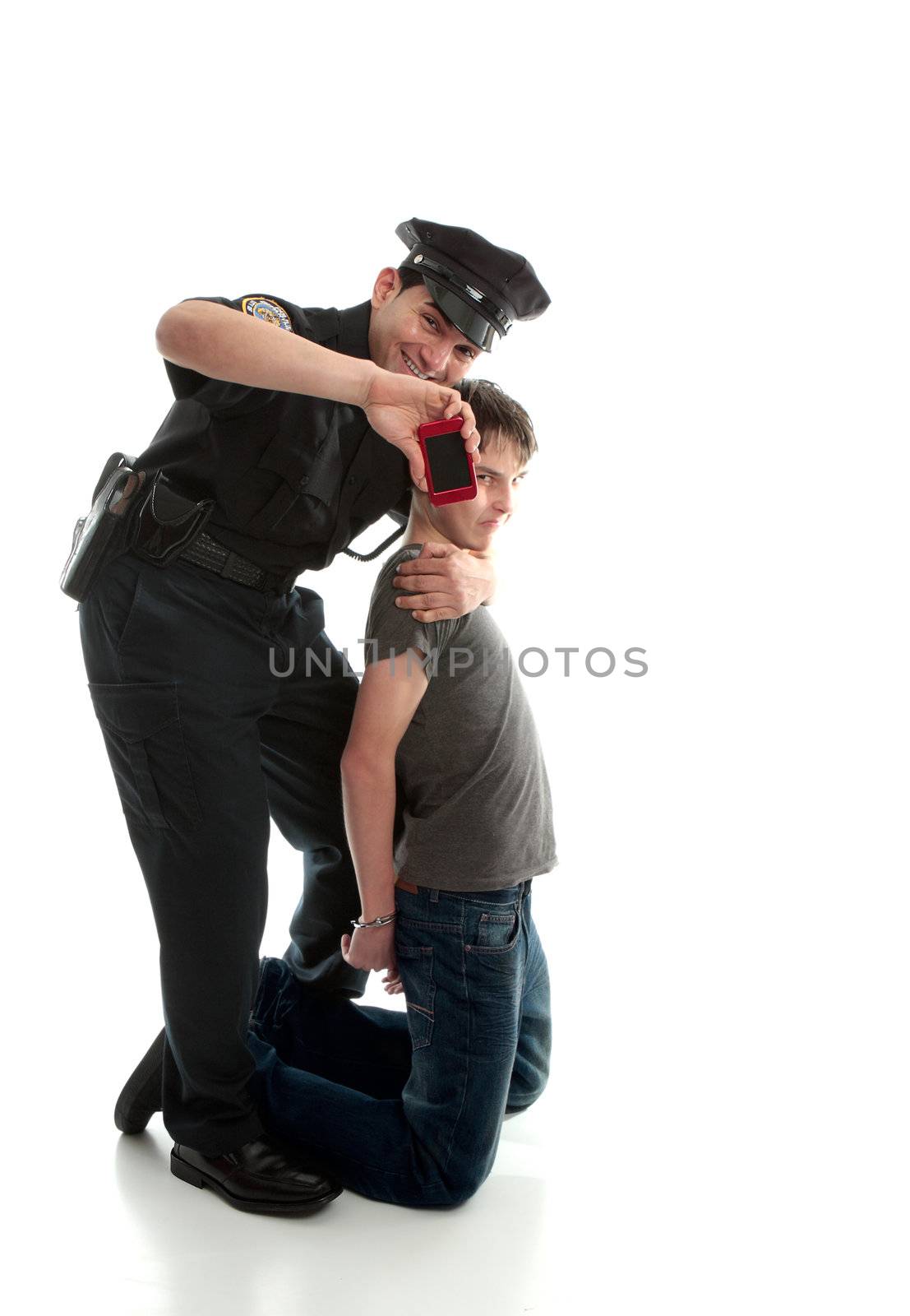 Happy policeman with apprehended teen boy by lovleah