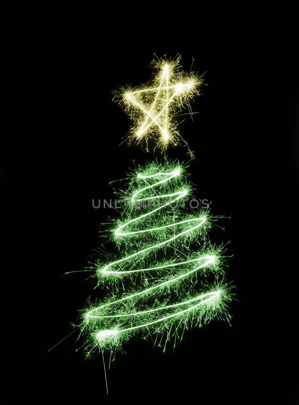 a christmas tree drawn in sparkling light trails