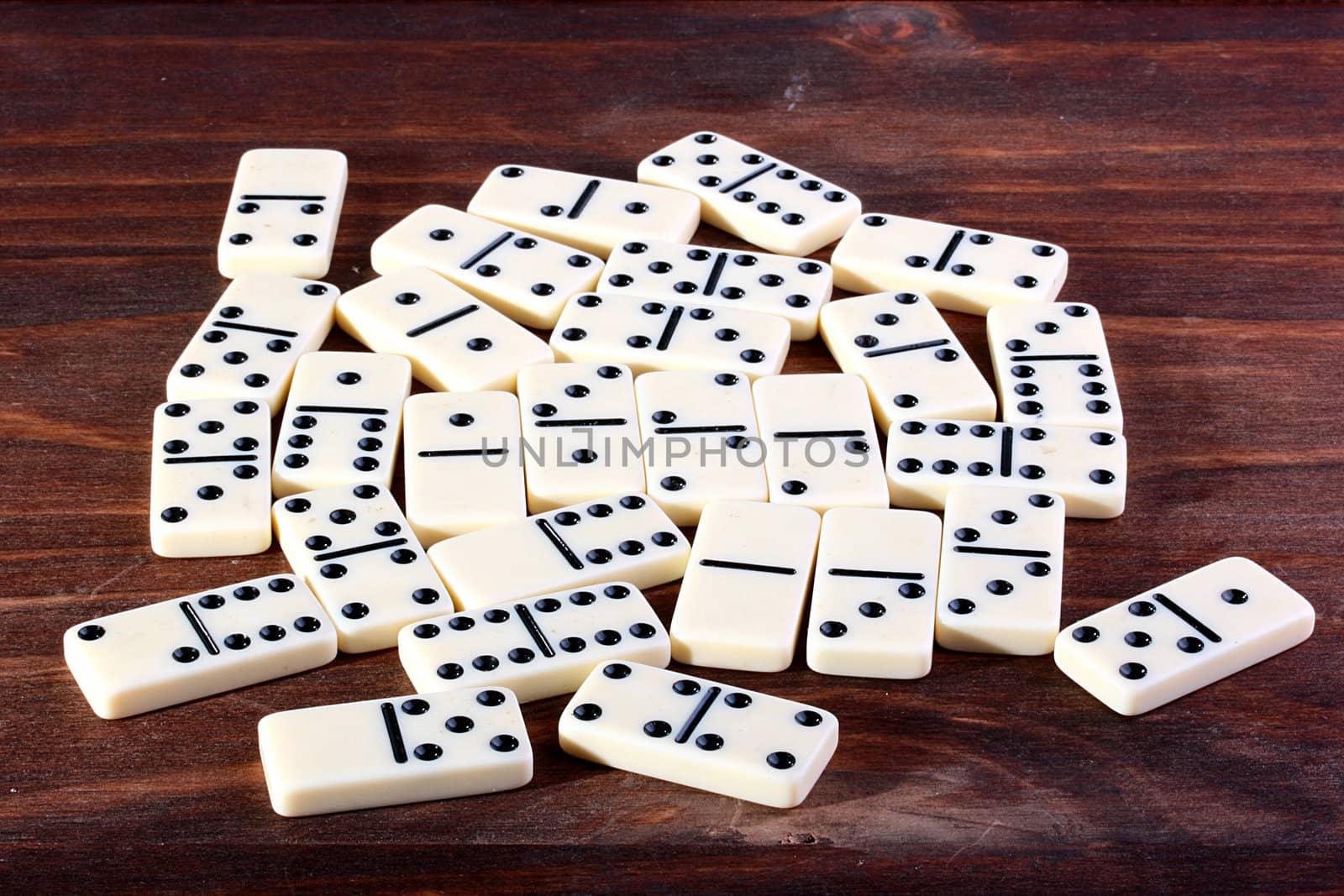 Dominoes on a wooden table. Game popular all over the world.
