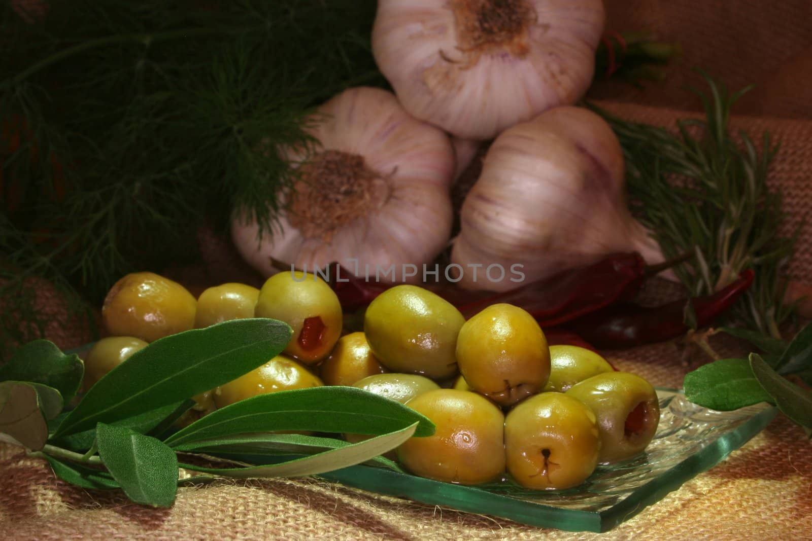 olives with olive branch and fresh ingredients