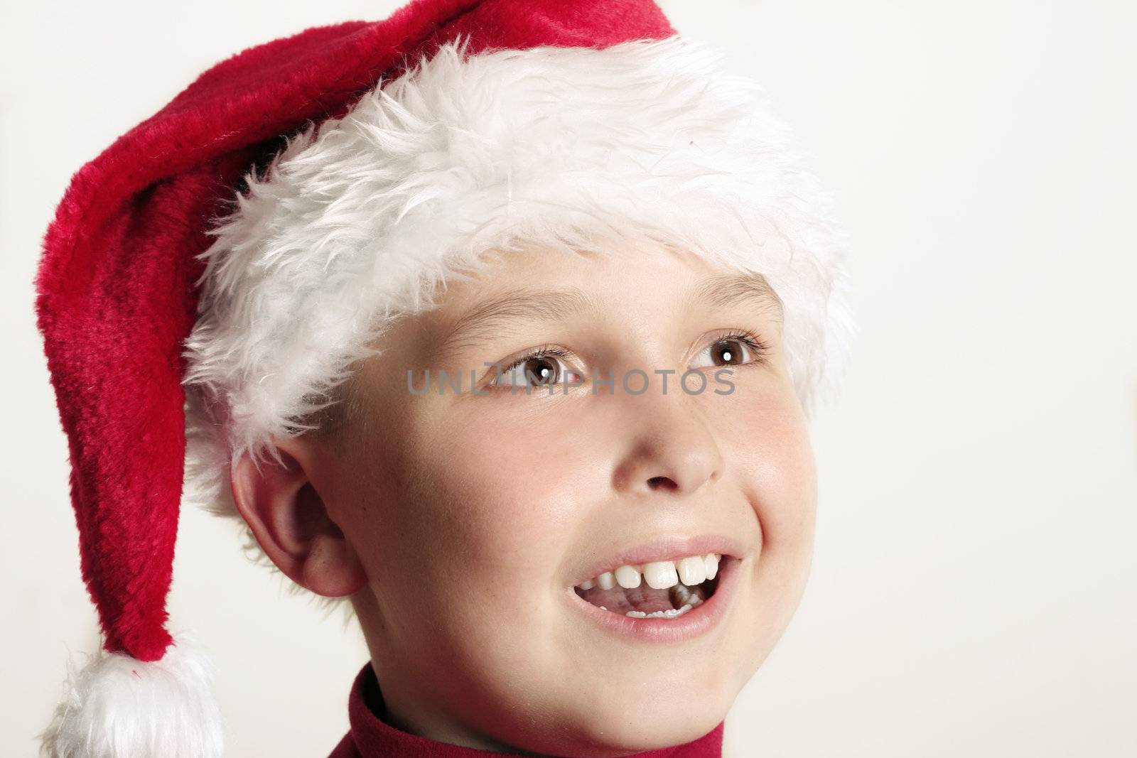 An excited boy enjoying Christmas festivities.  closeup