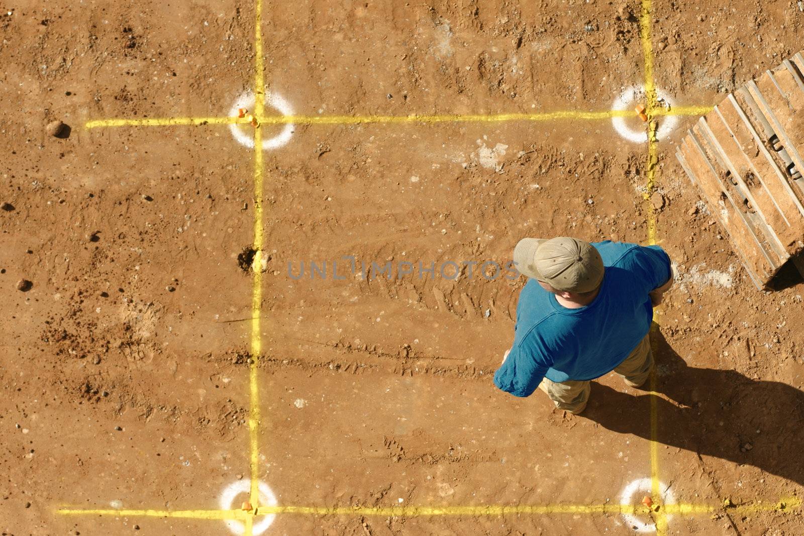 Builder stands by markings for the dig.
