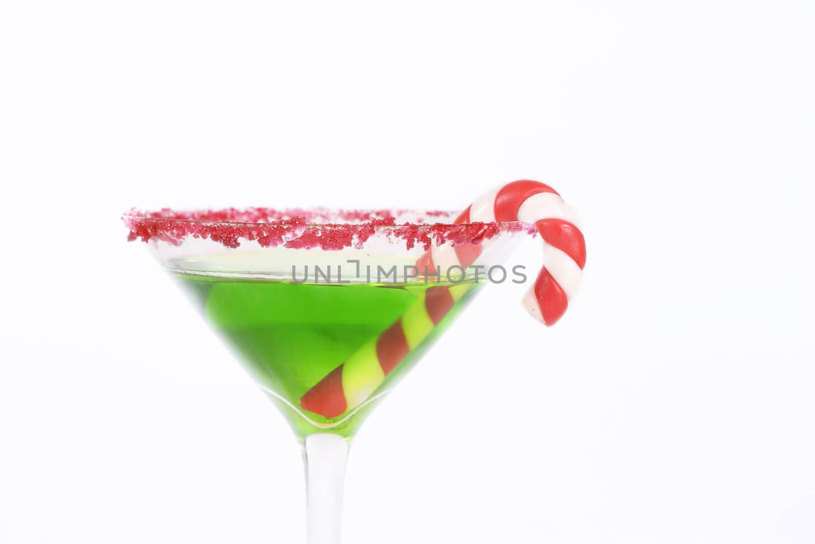 Green alcoholic drink edged in red with a candy cane decoration.
Christmas drinks, work party, celebrations, etc.