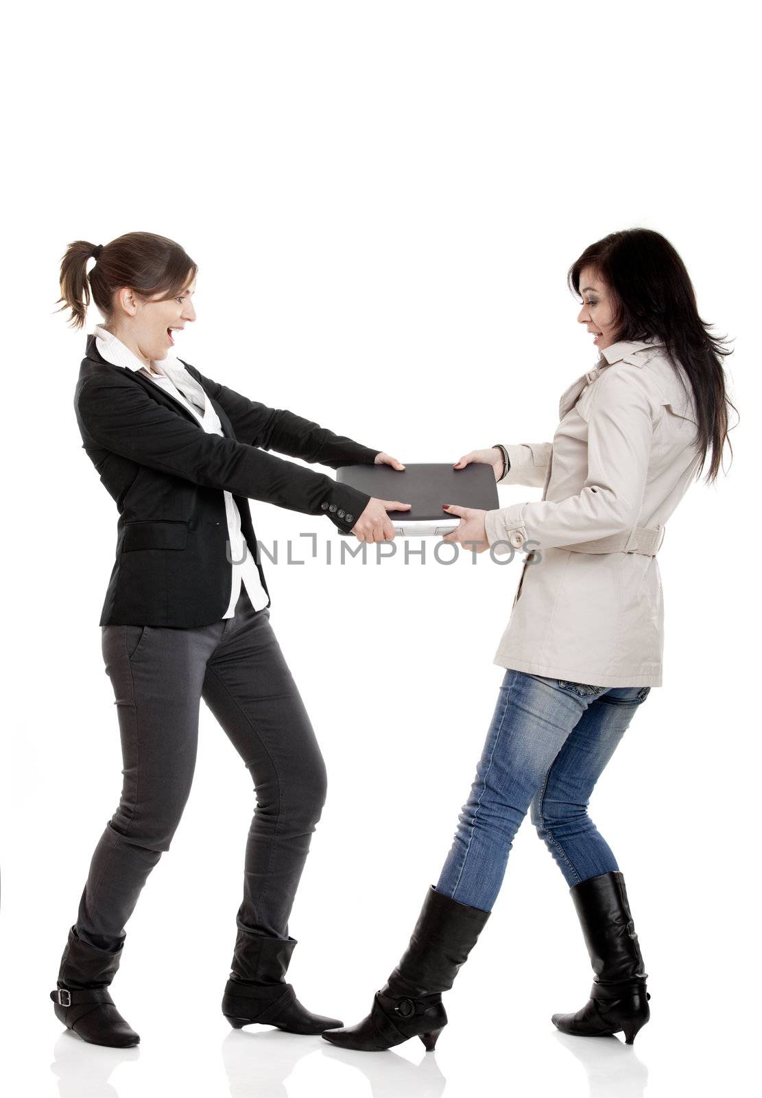 Two young women Fighting for a laptop, isolated on white