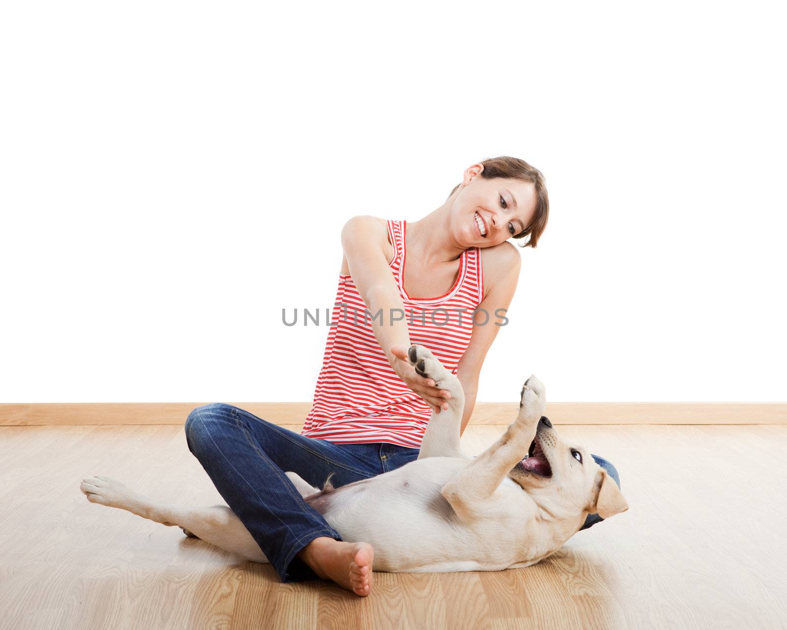 Beautiful young girl playing with a nice cute dog
