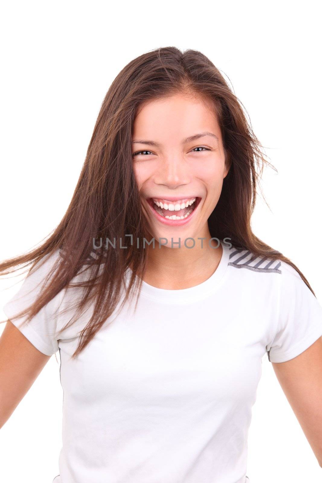 Sporty ethnic woman laughing after exercise.