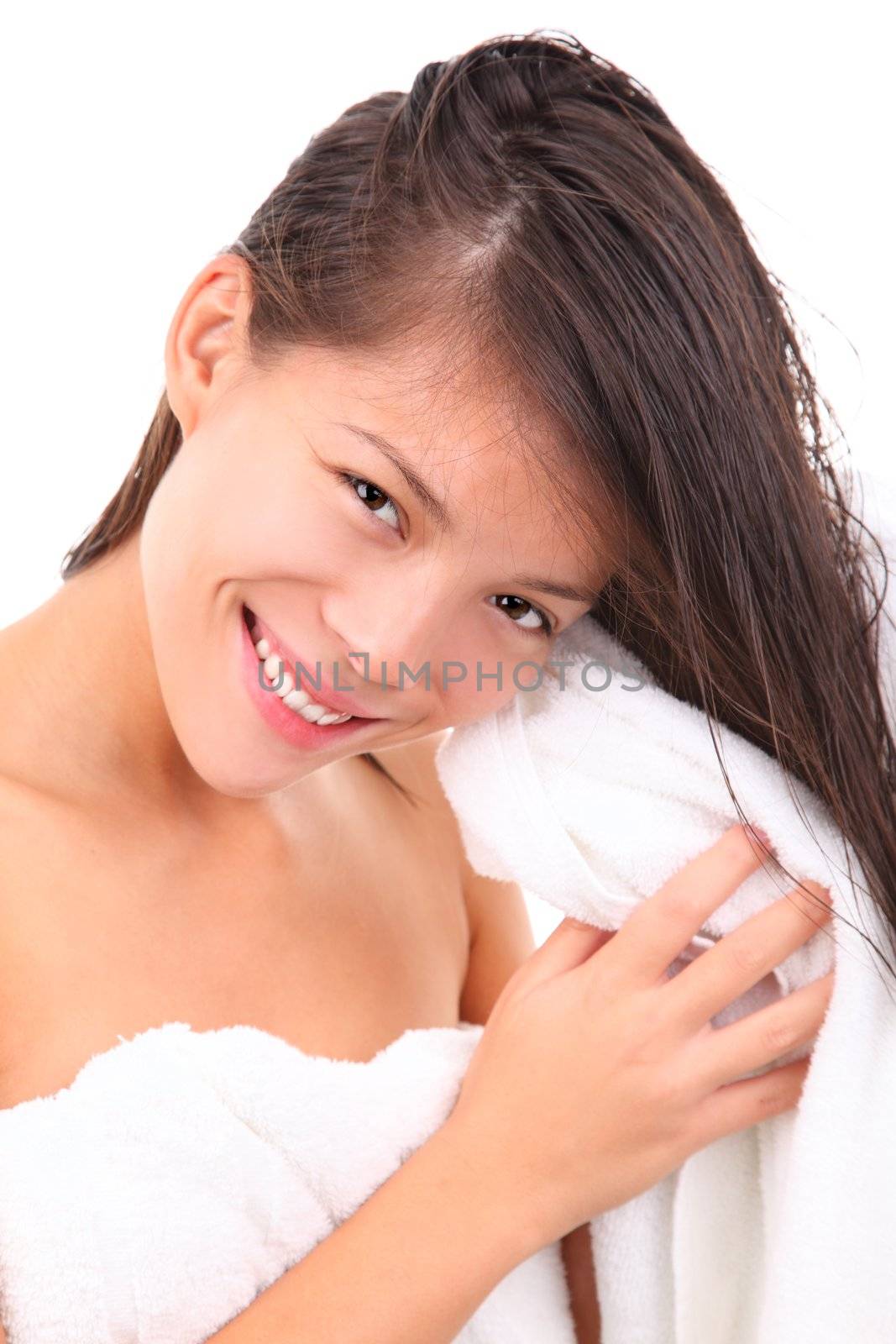 Woman drying her hair after the shower, taking care of her body. Isolated on white background.