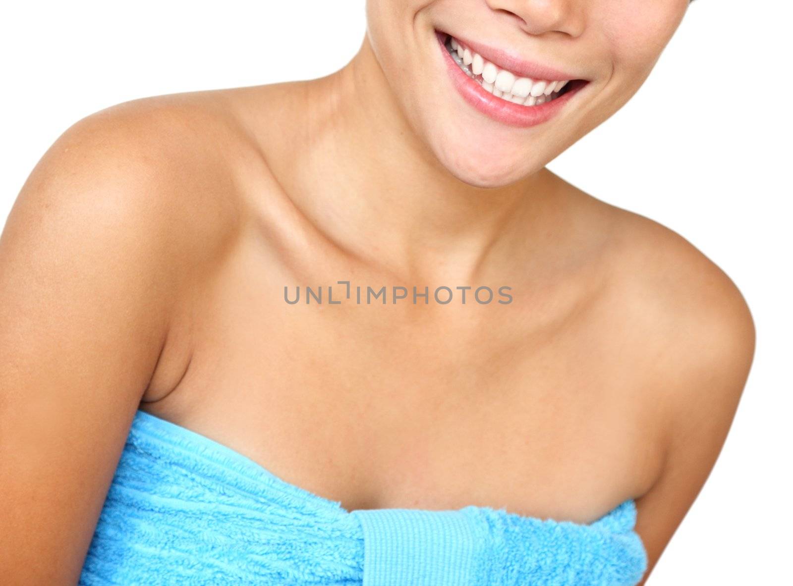 Towel woman .Smiling woman with towels just out of the shower. Beautiful mixed asian / caucasian young woman model. Isolated on white background.