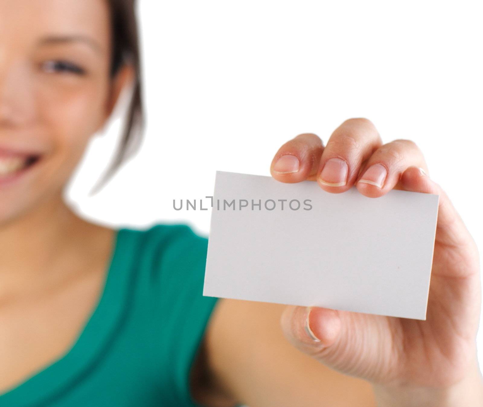 Business card. Beautiful young woman with big smile displaying a blank business card. Shallow depth of field, focus on card. Isolated on white background