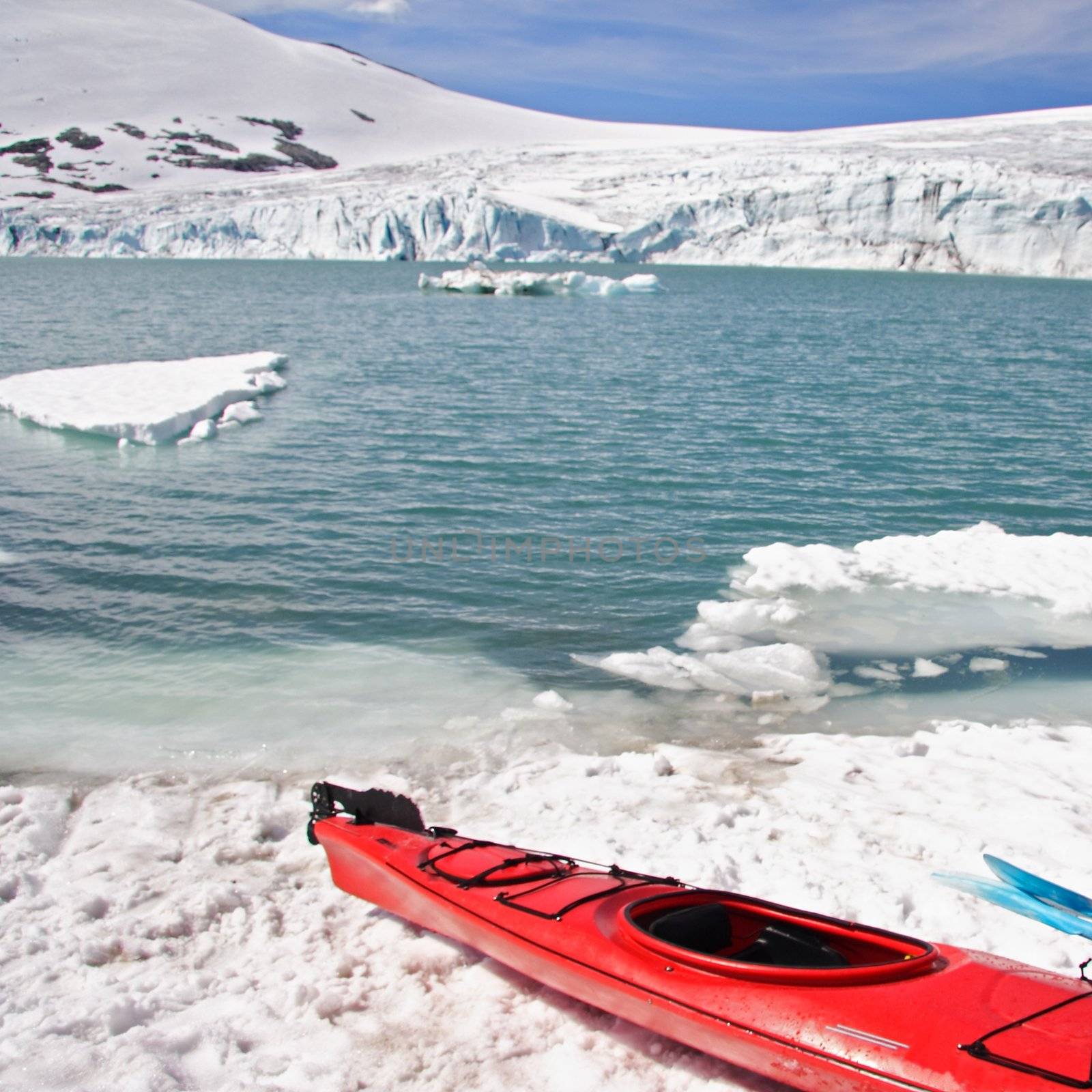 Kayak at glacier lake in Norway. Jostedalsbreen.