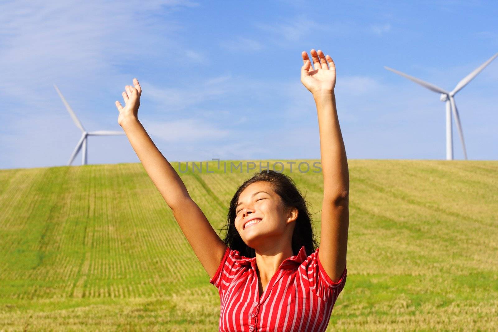 Wind turbines and happy woman by Maridav