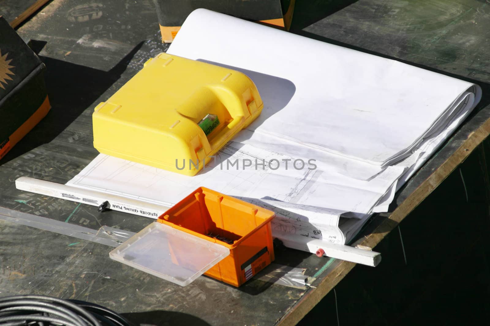 Plans on a worksite, an inspection box and toolbox