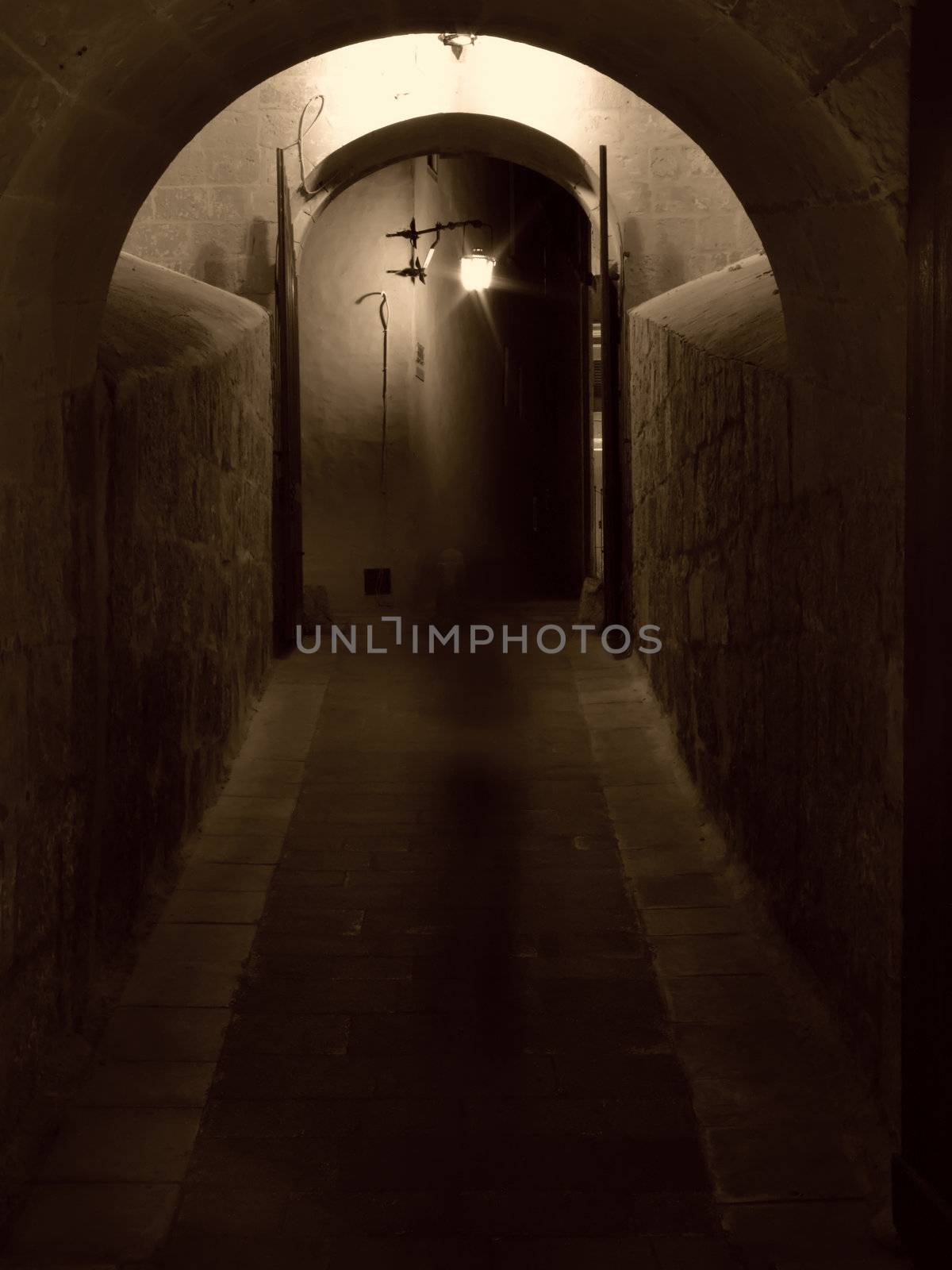 Ghostly figure in medieval gateway into the old city of Mdina in Malta