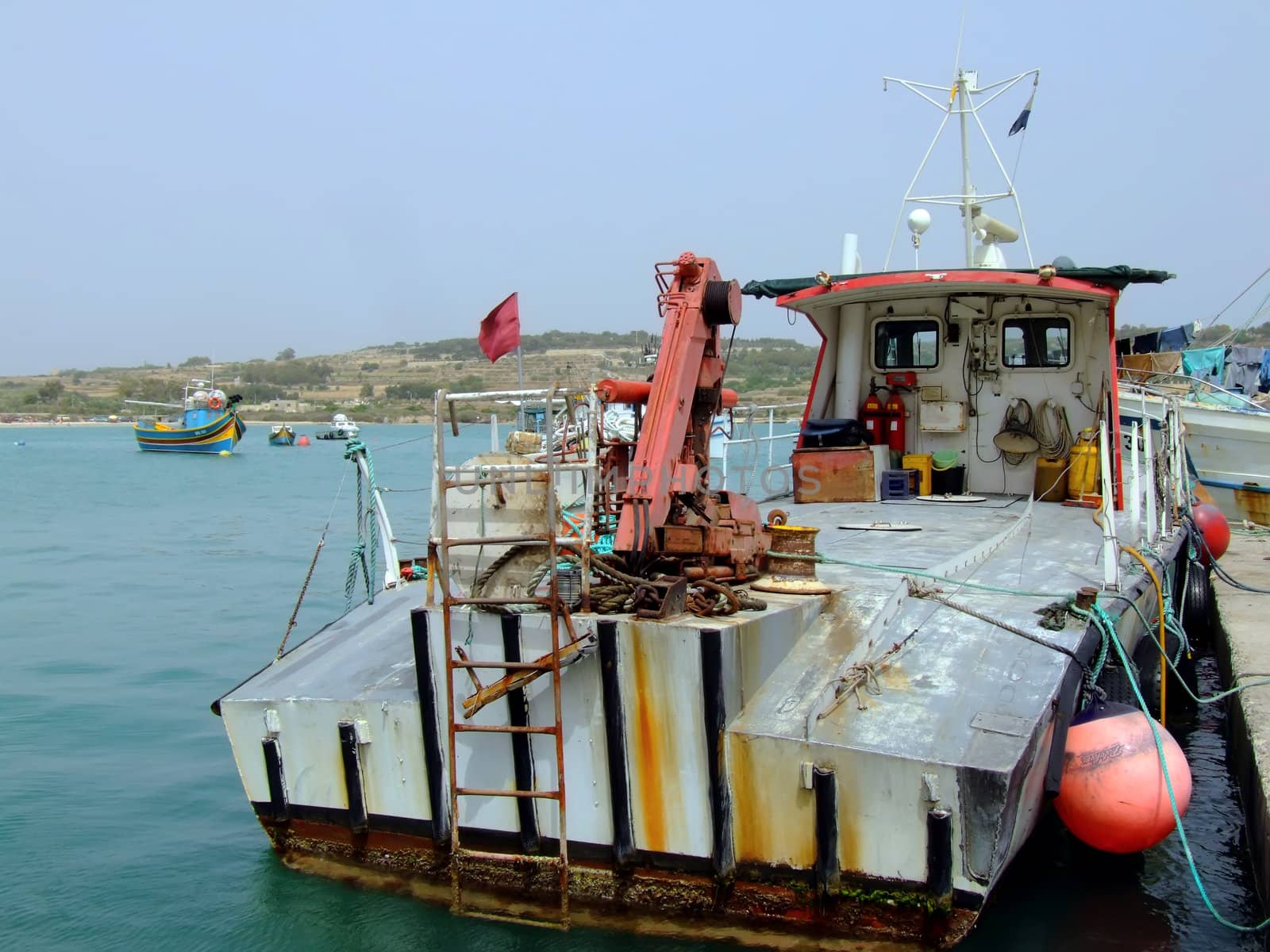 Fishing trawler moored at quay in Malta, in the Mediterranean