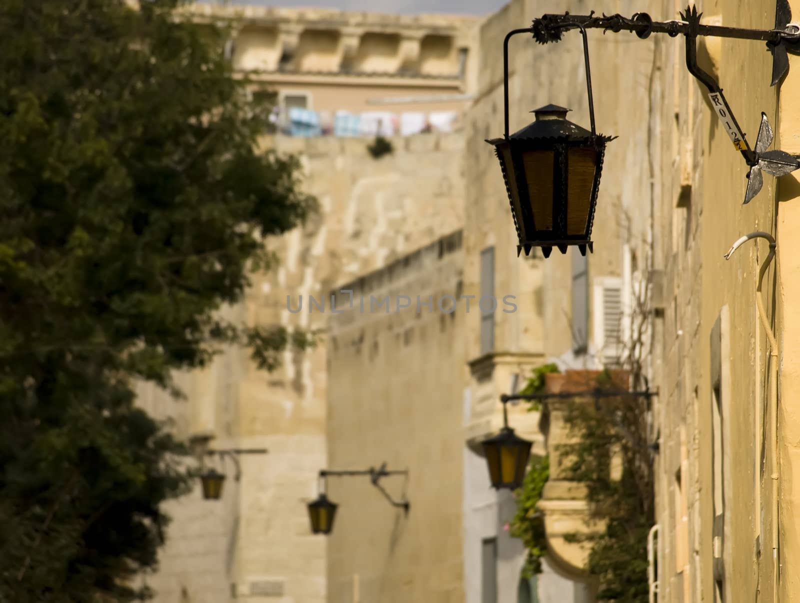 A medieval limestone facade in traditional baroque style in Mdina on the island of Malta
