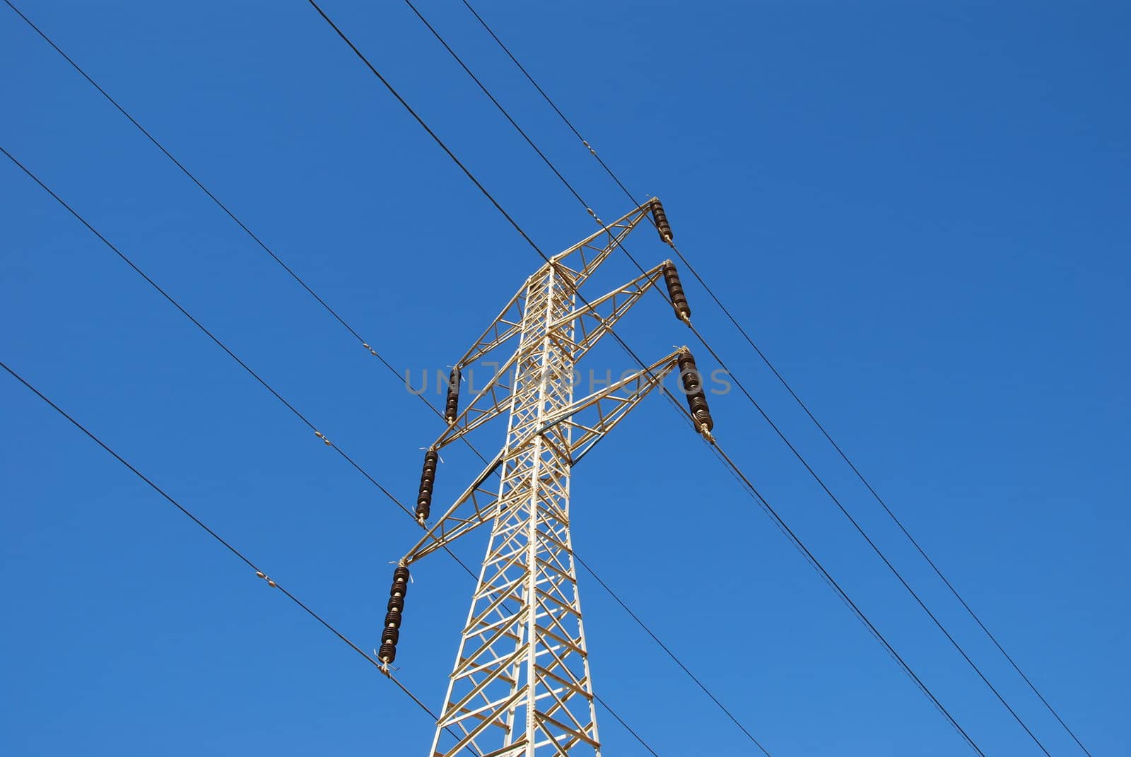Electrical tower on a background of the blue sky