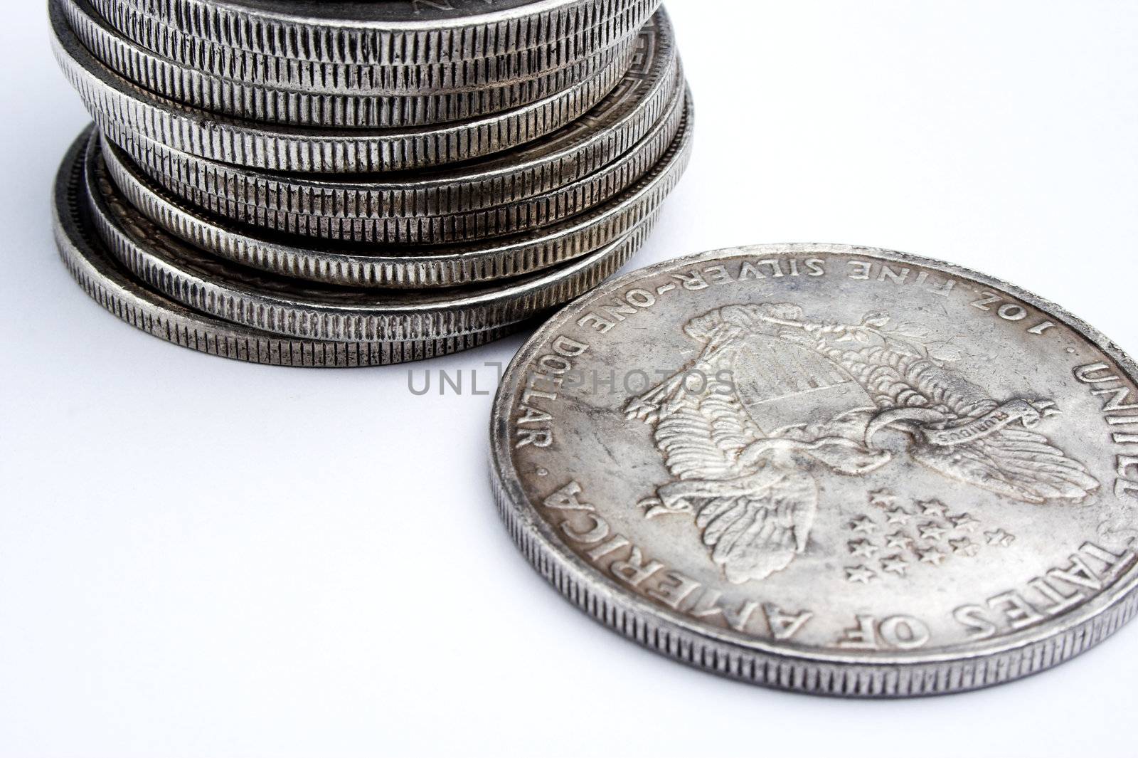 Stack of old dollars and coins