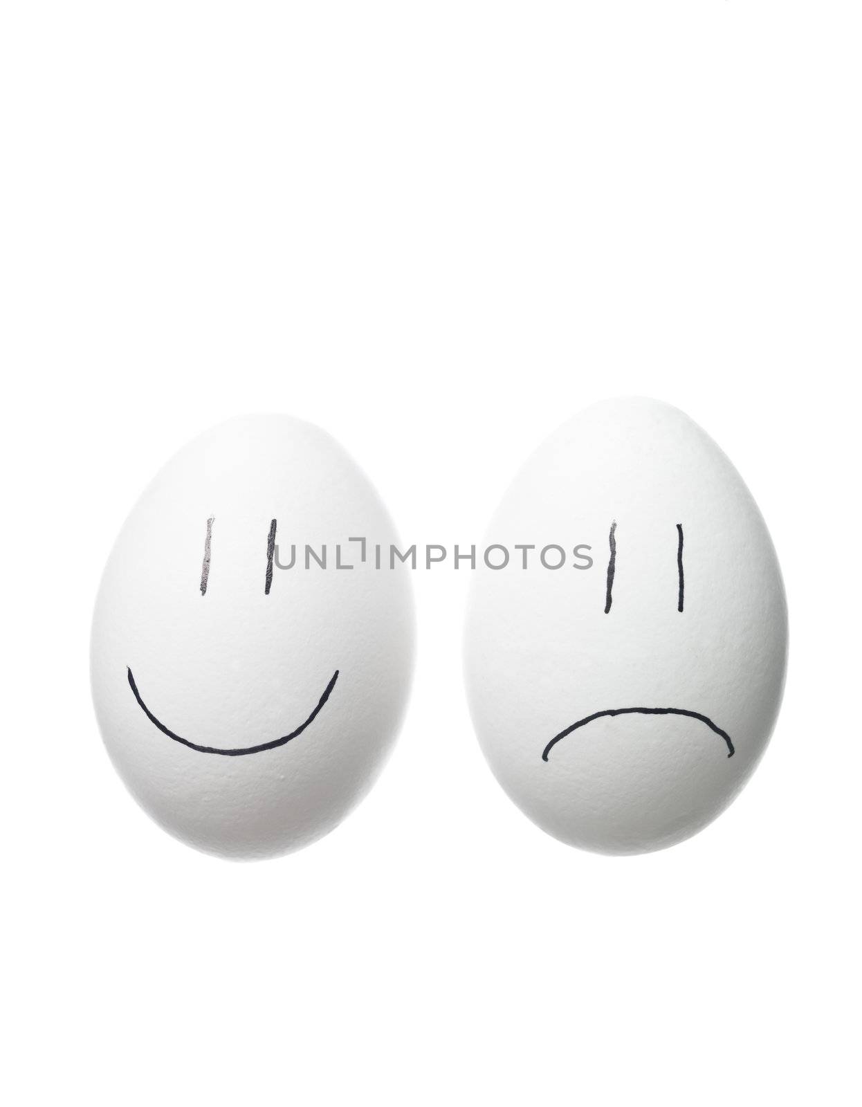 Sad face and a happy face painted on white eggs by gemenacom